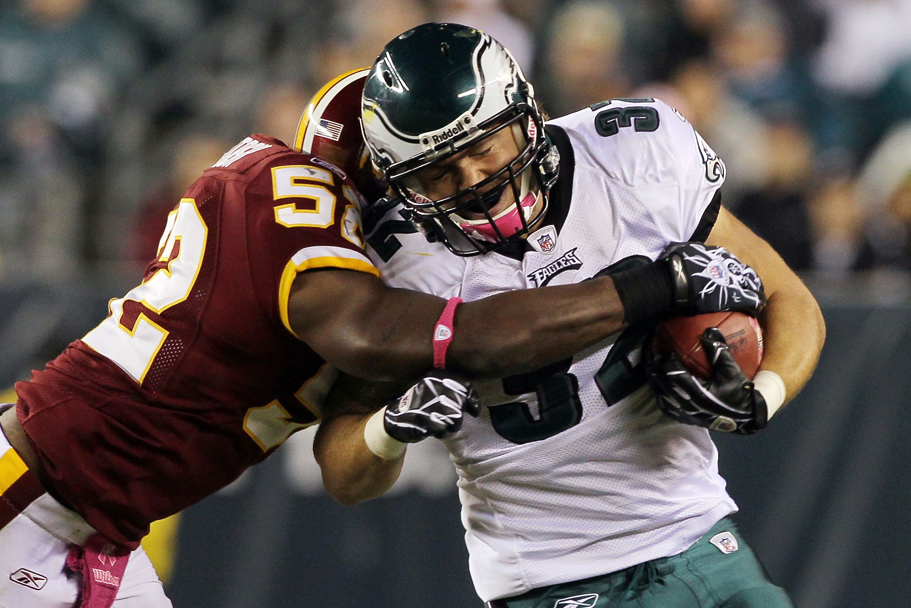 PHILADELPHIA - OCTOBER 03:  Owen Schmitt #32 of the Philadelphia Eagles tries to run the ball past Rocky McIntosh #52 of the Washington Redskins on October 3, 2010 at Lincoln Financial Field in Philadelphia, Pennsylvania.  (Photo by Jim McIsaac/Getty Imag