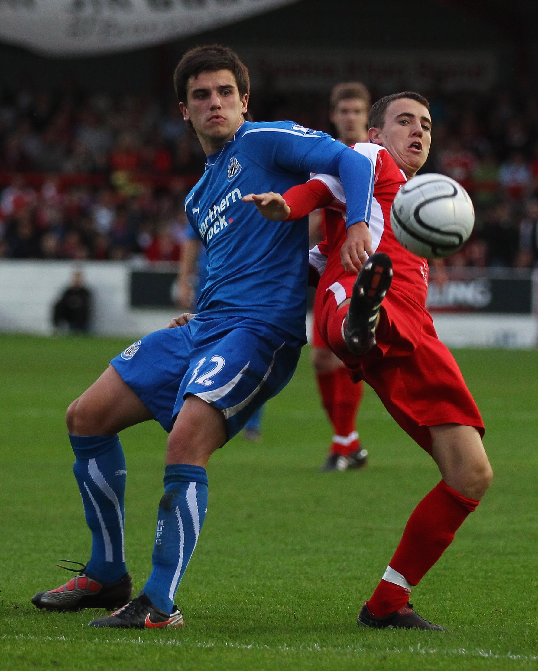 ACCRINGTON, ENGLAND - AUGUST 25:  Ryan Donaldson of Newcastle United battles for the ball with James Ryan of Accrington Stanley during the Carling Cup 2nd Round match between Accrington Stanley and Newcastle United at the Crown Ground on August 25, 2010 i