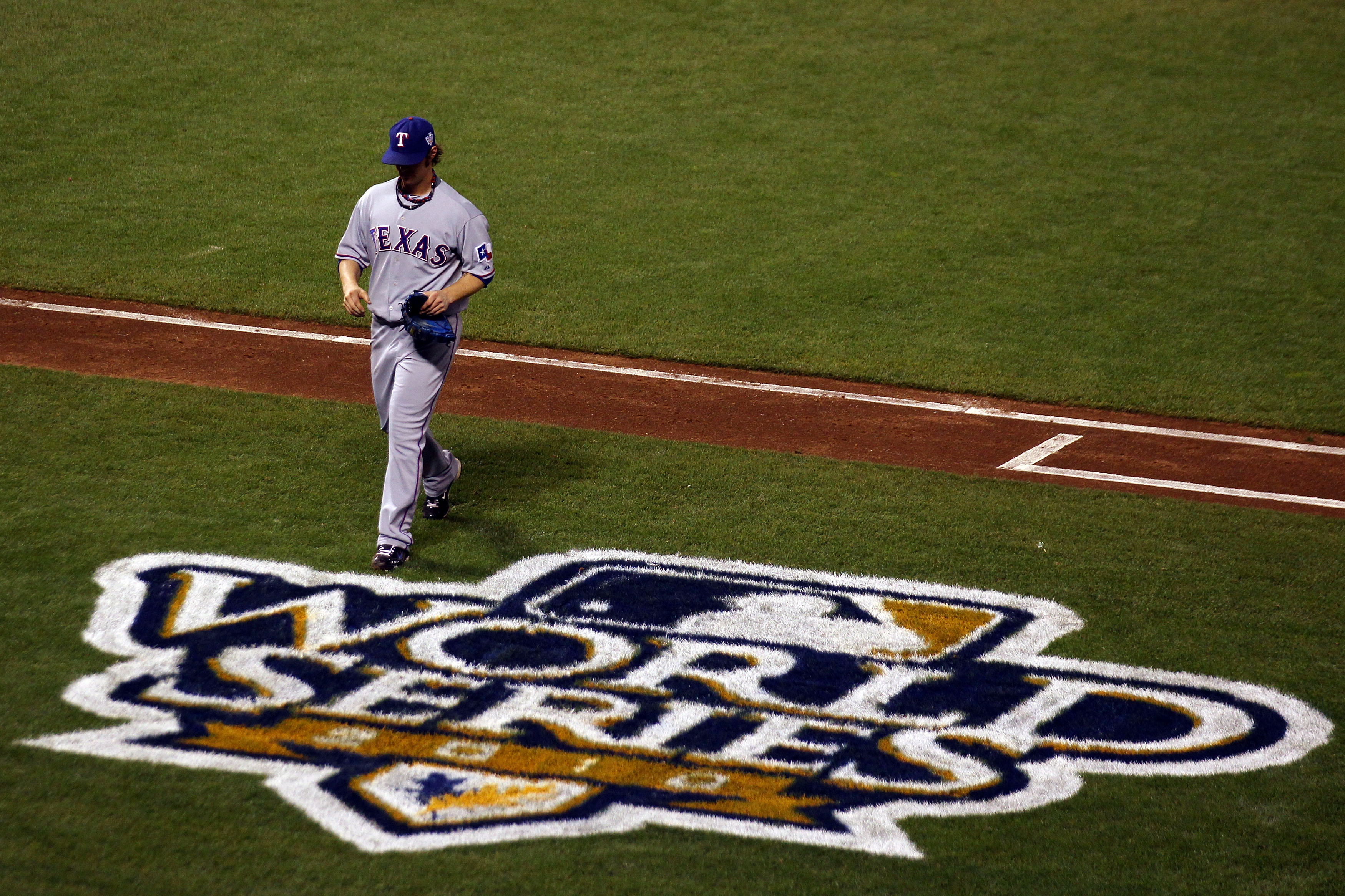 SAN FRANCISCO - OCTOBER 28:  Starting pitcher C.J. Wilson #36 of the Texas Rangers walks off the field while taking on the San Francisco Giants during Game Two of the 2010 MLB World Series at AT&T Park on October 28, 2010 in San Francisco, California.  (P