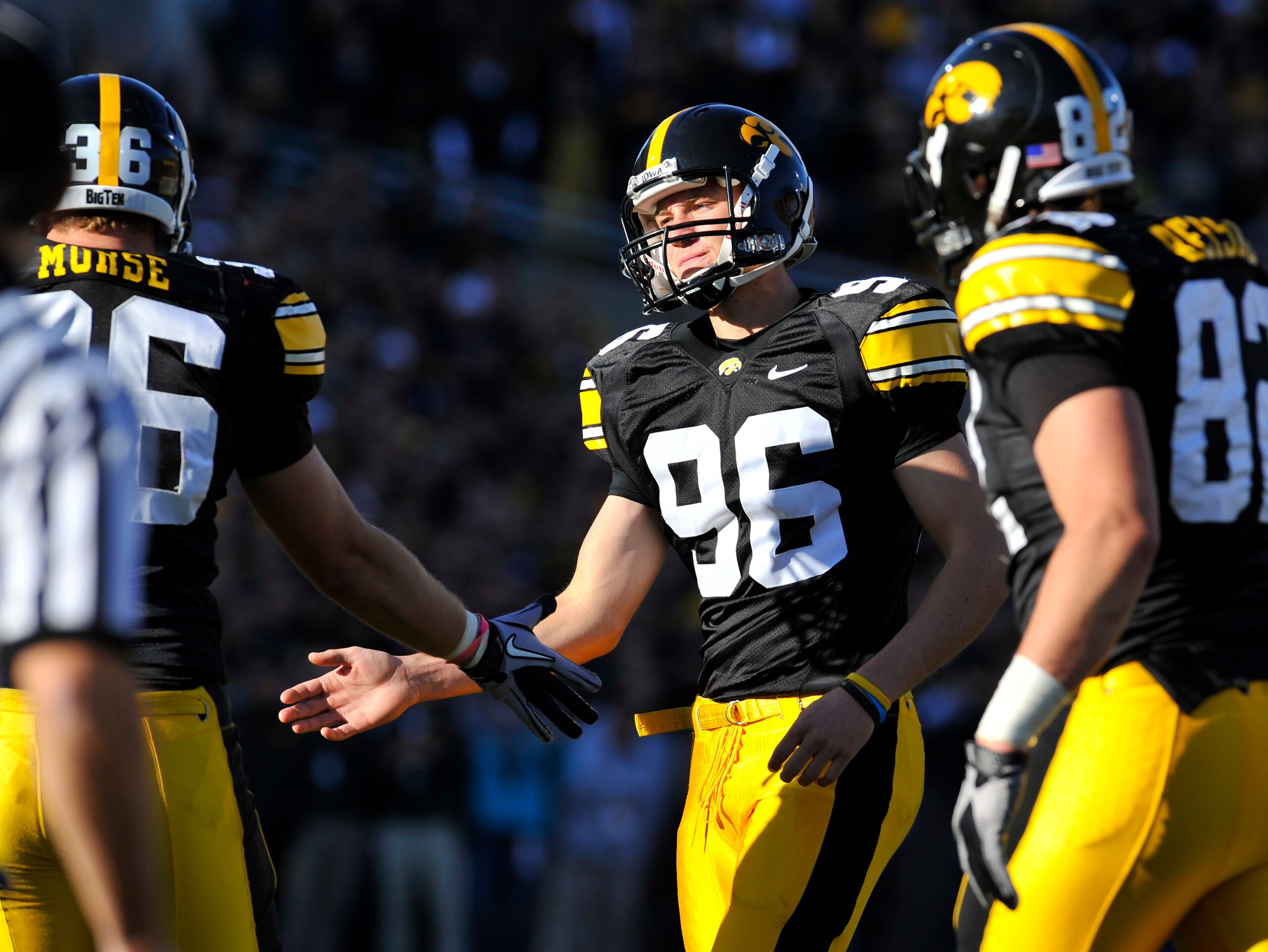IOWA CITY, IA - OCTOBER 30- Kicker Mike Meyer #96 of the University of Iowa Hawkeyes celebrates with teammate Brett Morse #36 after kicking an extra point during play against the Michigan State Spartans at Kinnick Stadium on October 30, 2010 in Iowa City,