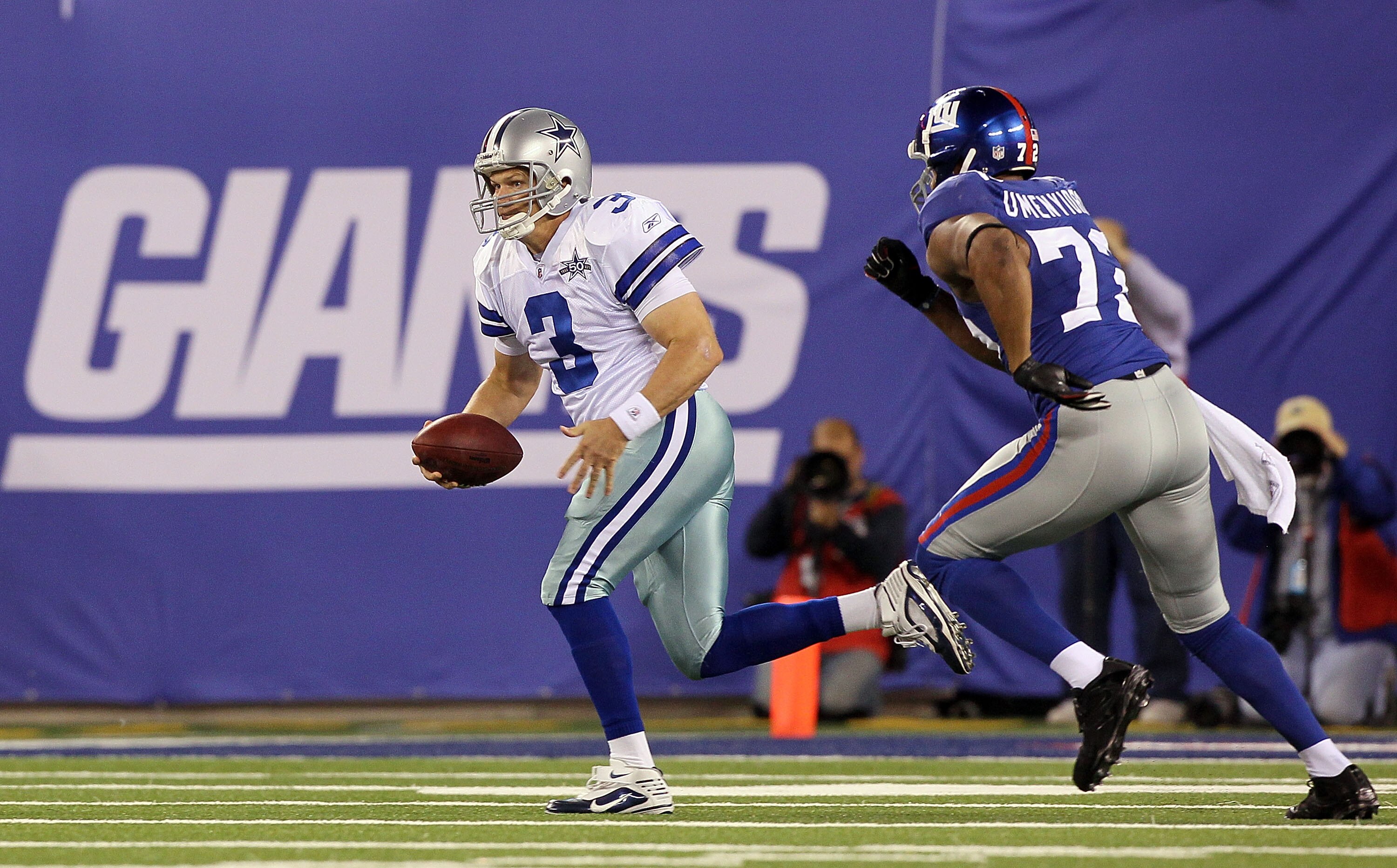 EAST RUTHERFORD, NJ - NOVEMBER 14:  Jon Kitna #3 of the Dallas Cowboys runs the ball against Osi Umenyiora #72 of the New York Giants on November 14, 2010 at the New Meadowlands Stadium in East Rutherford, New Jersey. The Cowboys defeated the Giants 33-20