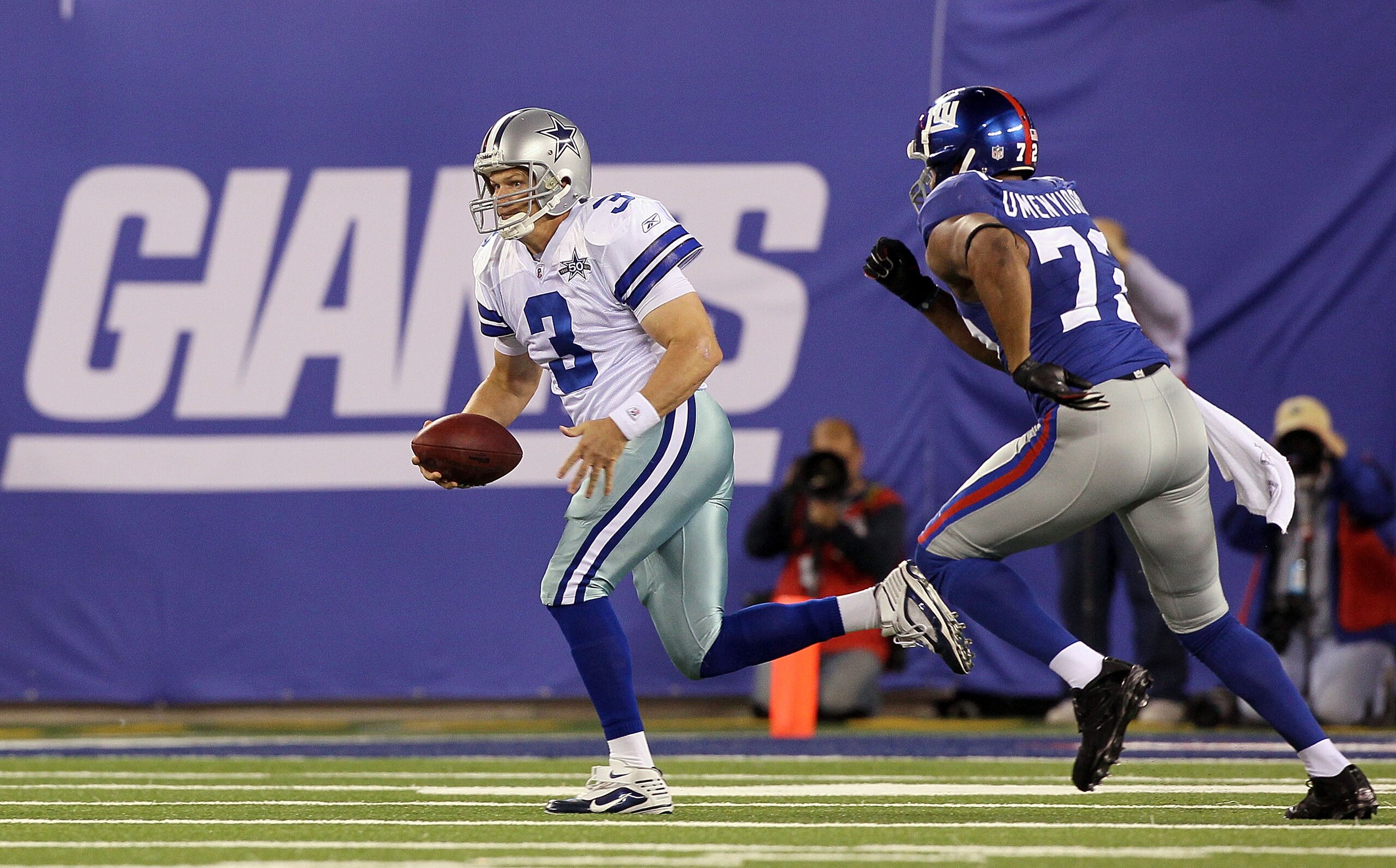 EAST RUTHERFORD, NJ - NOVEMBER 14: Jon Kitna #3 of the Dallas Cowboys runs the ball against Osi Umenyiora #72 of the New York Giants on November 14, 2010 at the New Meadowlands Stadium in East Rutherford, New Jersey. The Cowboys defeated the Giants 33-20 EAST RUTHERFORD, NJ - NOVEMBER 14: Jon Kitna #3 of the Dallas Cowboys runs the ball against Osi Umenyiora #72 of the New York Giants on November 14, 2010 at the New Meadowlands Stadium in East Rutherford, New Jersey. The Cowboys defeated the Giants 33-20