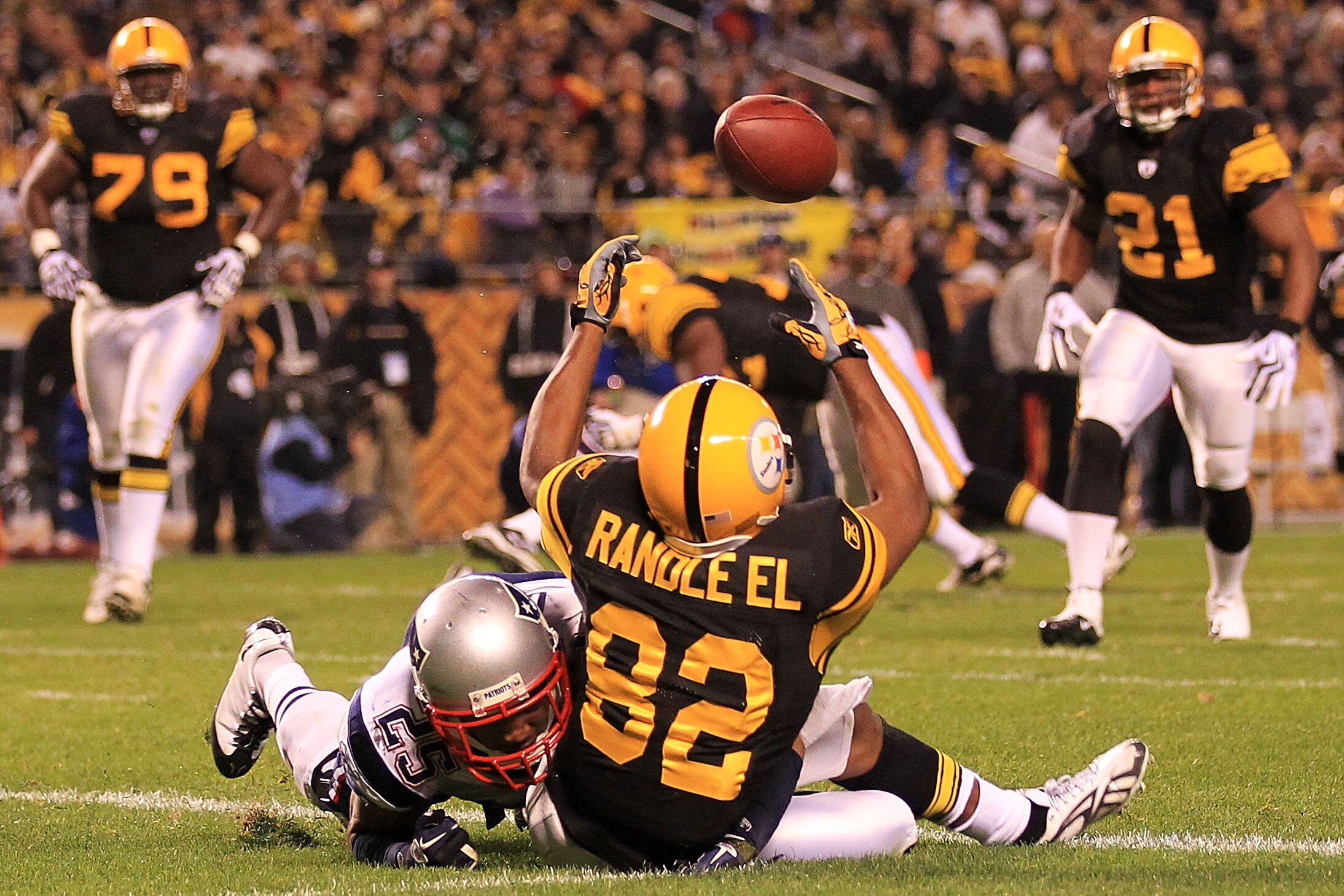PITTSBURGH - NOVEMBER 14:  Antwaan Randle El #82 of the Pittsburgh Steelers fumbles a catch in the endzone under pressure from Patrick Chung #25 of the New England Patriots on November 14, 2010 at Heinz Field in Pittsburgh, Pennsylvania.  (Photo by Chris