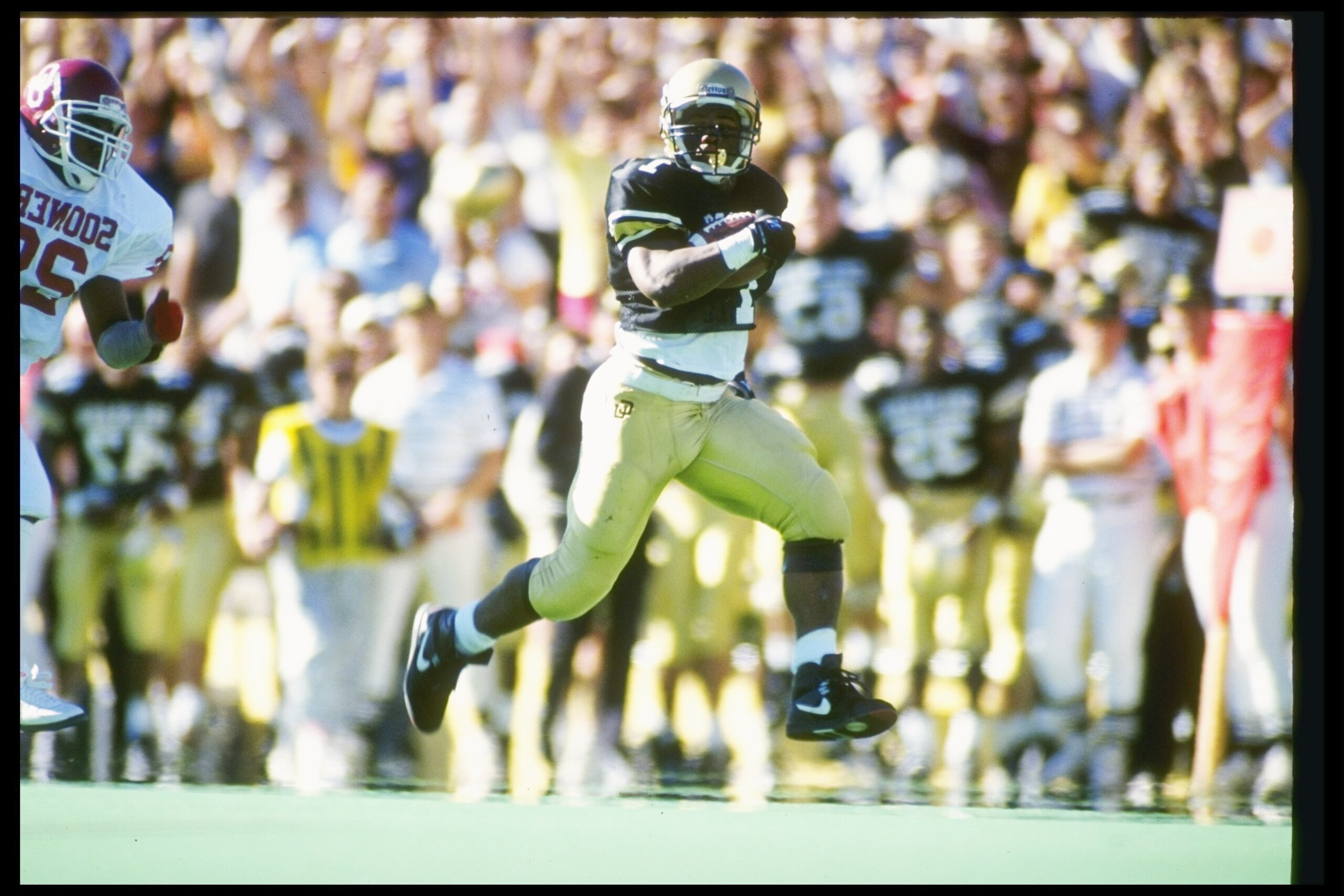 27 Oct 1990: Running back James Hill of the Colorado Buffaloes runs down the field during a game against the Oklahoma Sooners at Folsom Field in Boulder, Colorado. Colorado won the game 32-23.