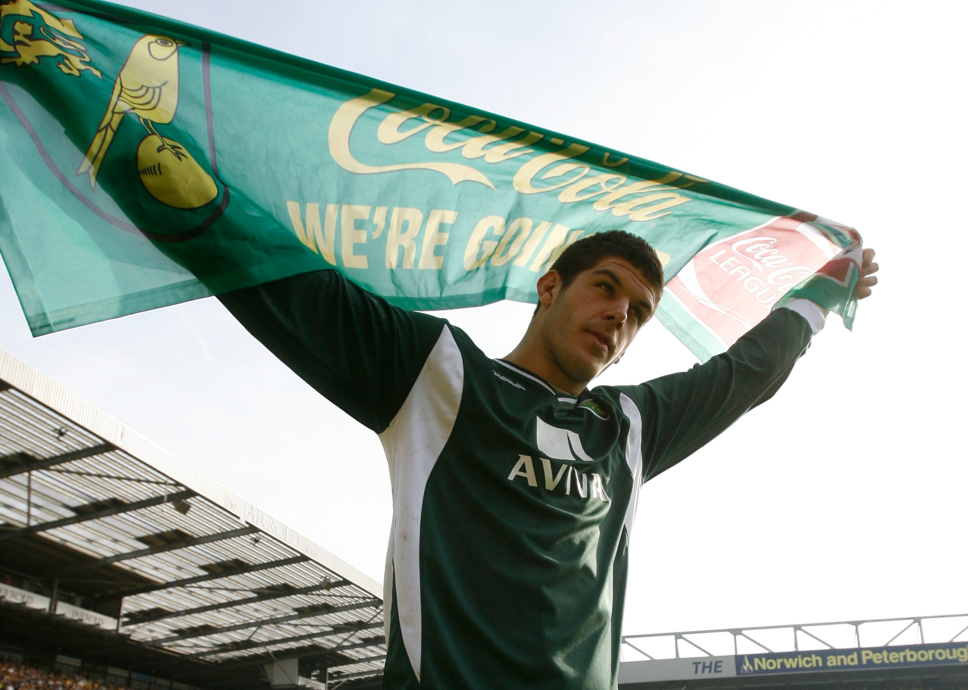 NORWICH, ENGLAND - APRIL 24: Norwich City goalkeeper Fraser Forster celebrates as his team do a lap of honour around the pitch after winning the match and becoming champions of League One during the Coca Cola League One match between Norwich City and Gill