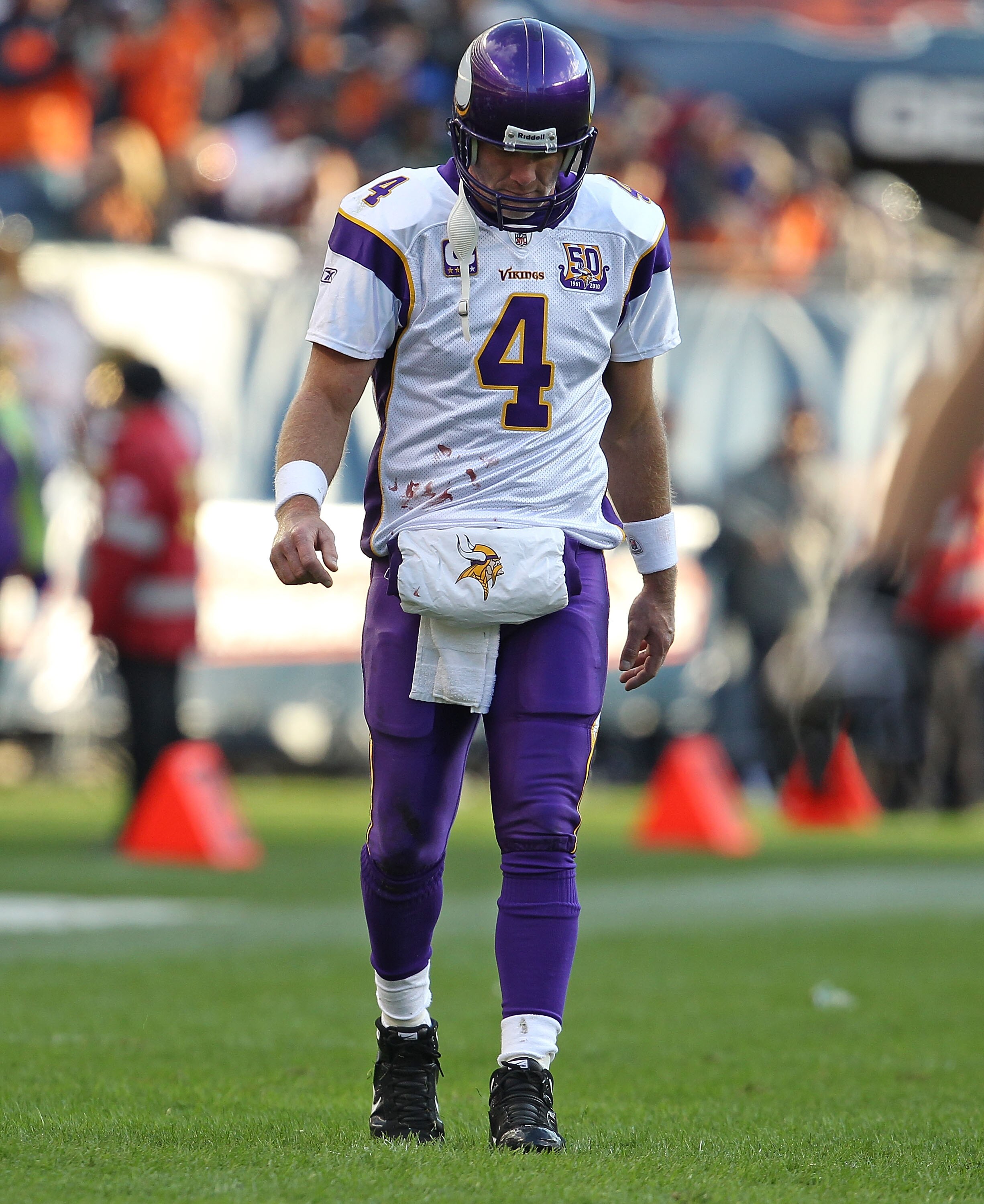 CHICAGO - NOVEMBER 14: Brett Favre #4 of the Minnesota Vikings walks back to the field of play from the sidelines during a game against the Chicago Bears at Soldier Field on November 14, 2010 in Chicago, Illinois. The Bears defeated the Vikings 27-13. (Ph