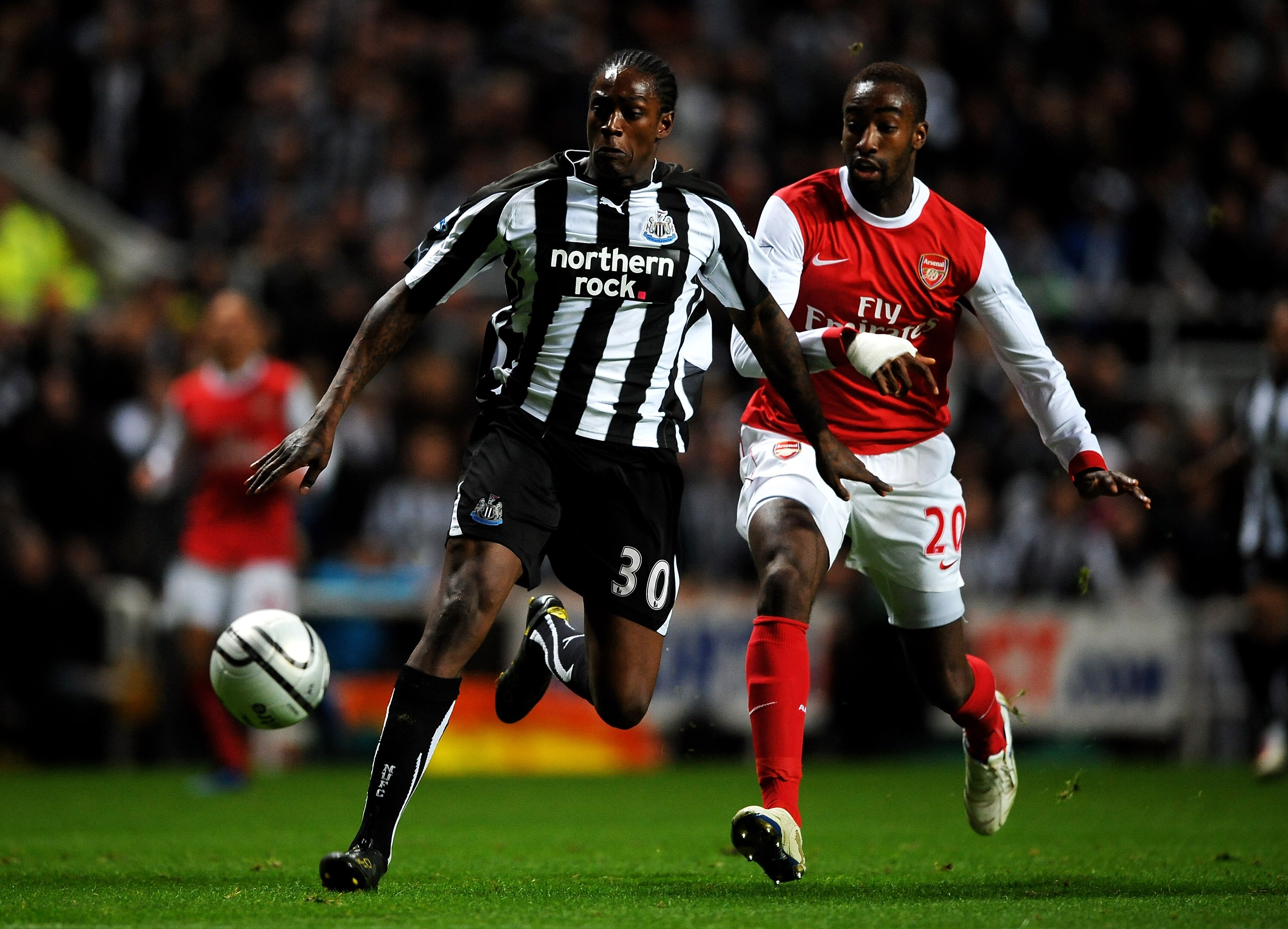 NEWCASTLE, UNITED KINGDOM - OCTOBER 27:   Nile Ranger of Newcastle United competes with Johan Djourou of Arsenal during the Carling Cup Fourth Round match between Newcastle United and Arsenal at St James' Park on October 27, 2010 in Newcastle, England. (P