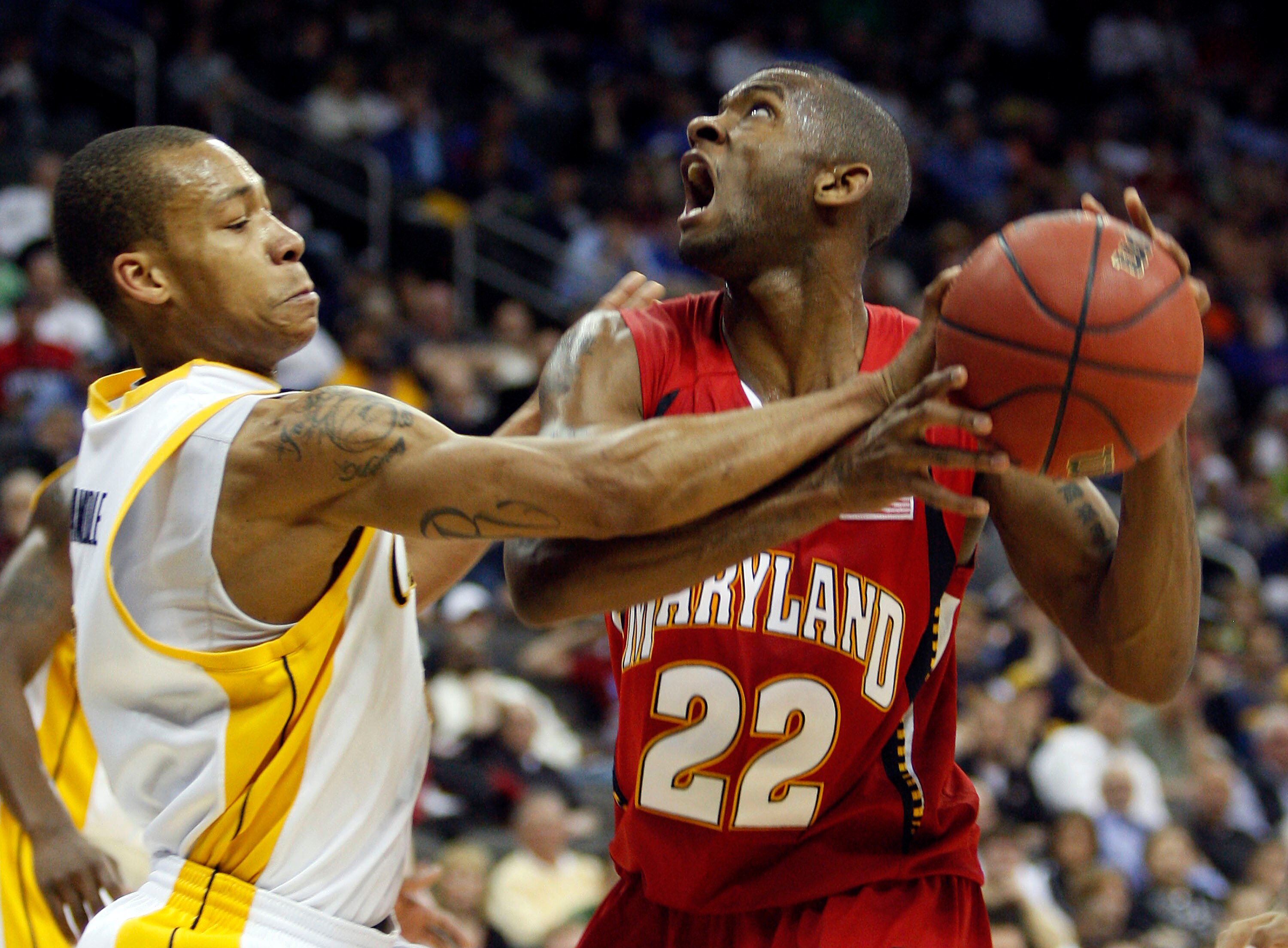KANSAS CITY, MO - MARCH 19:  Jerome Randle #2 of the California Golden Bears gets a hand on the ball as Adrian Bowie #22 of the Maryland Terrapins makes a move to the basket in the second half during the first round of the NCAA Division I Men's Basketball