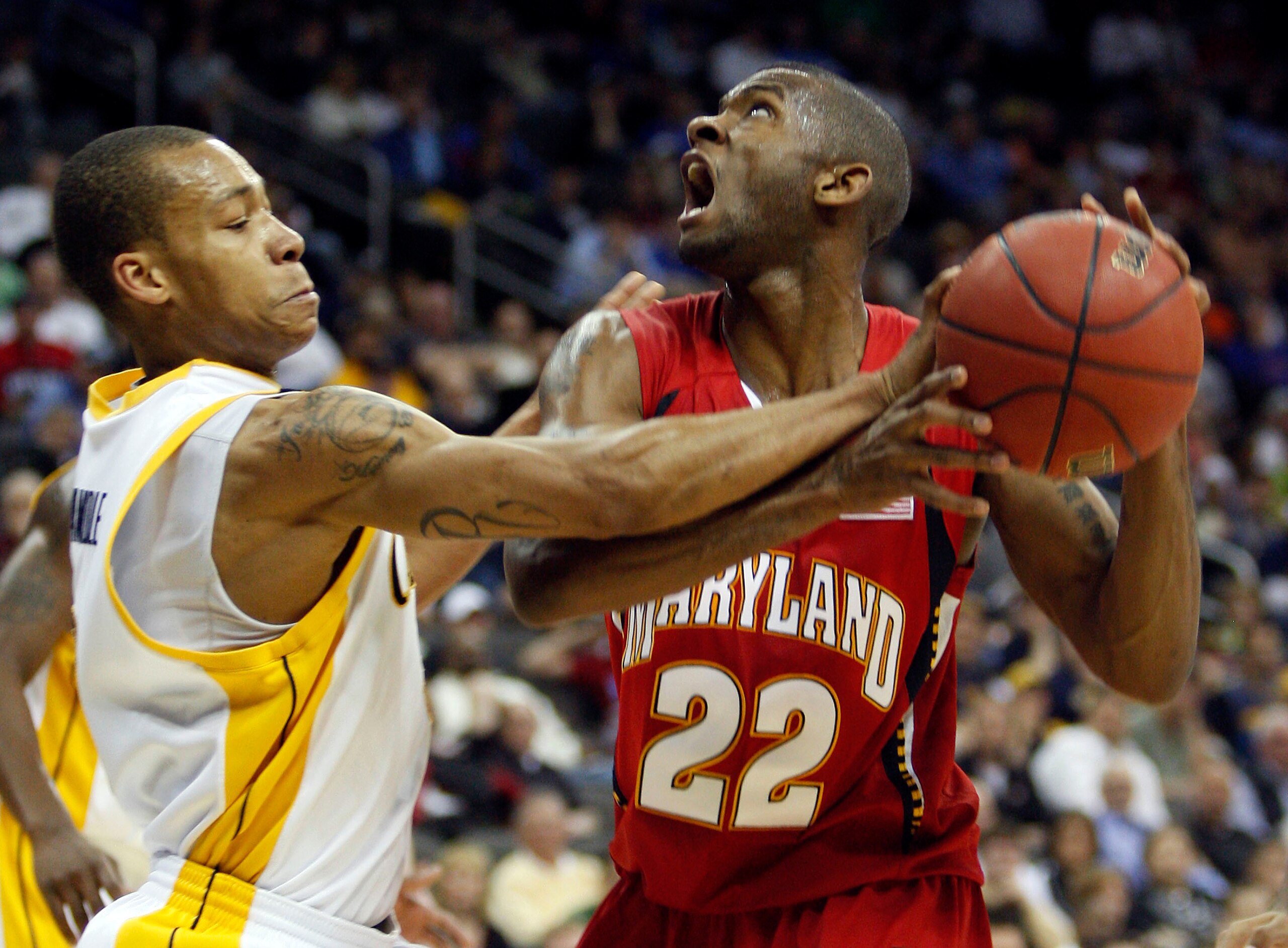 KANSAS CITY, MO - MARCH 19: Jerome Randle #2 of the California Golden Bears gets a hand on the ball as Adrian Bowie #22 of the Maryland Terrapins makes a move to the basket in the second half during the first round of the NCAA Division I Men's Basketball KANSAS CITY, MO - MARCH 19: Jerome Randle #2 of the California Golden Bears gets a hand on the ball as Adrian Bowie #22 of the Maryland Terrapins makes a move to the basket in the second half during the first round of the NCAA Division I Men's Basketball
