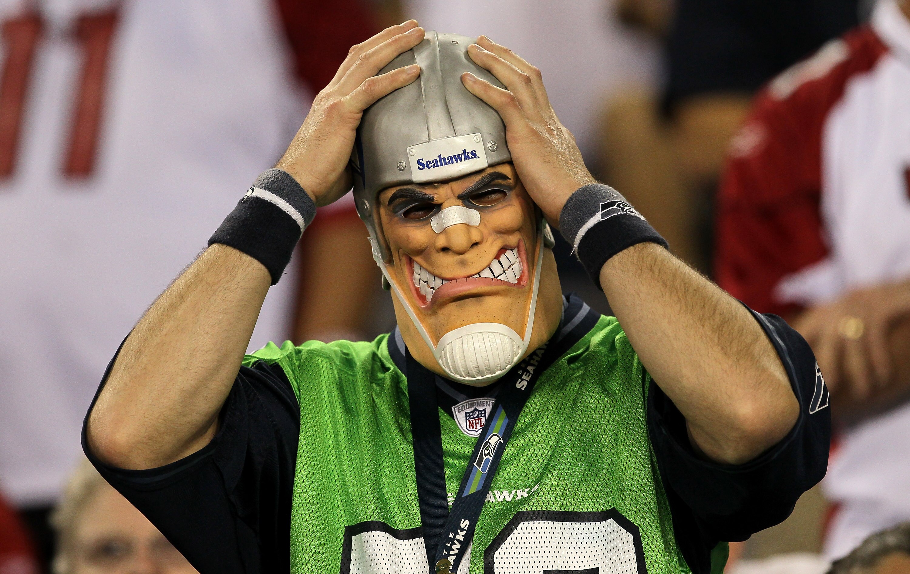 GLENDALE, AZ - NOVEMBER 14:   A Seattle Seahawks fan adjusts his mask during the game with the Arizona Cardinals at University of Phoenix Stadium on November 14, 2010 in Glendale, Arizona. Seattle won 36-18. (Photo by Stephen Dunn/Getty Images)