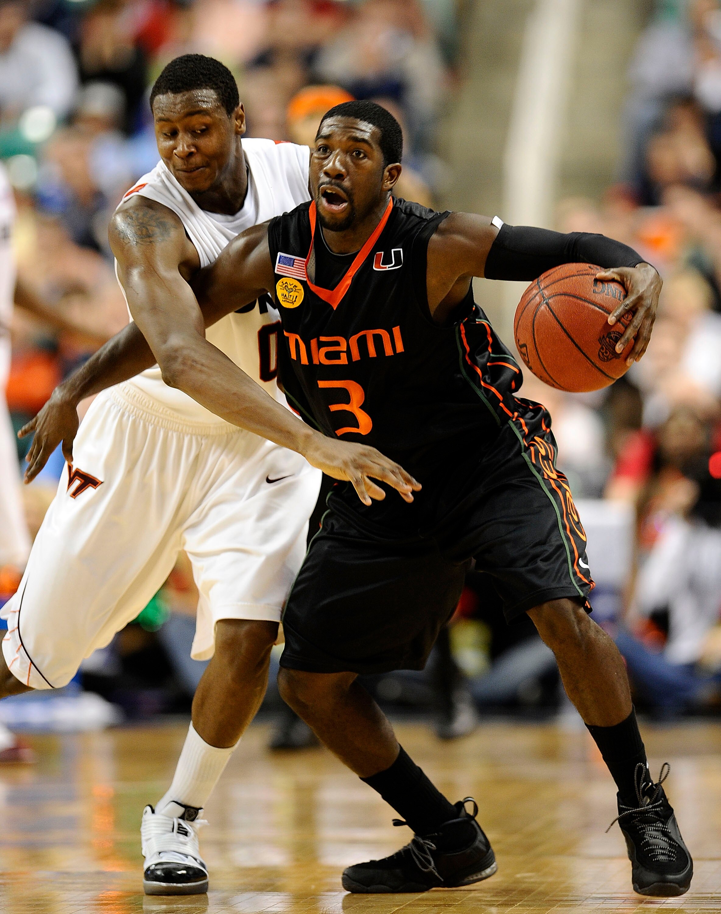 GREENSBORO, NC - MARCH 12:  Jeff Allen #00 of the Virginia Tech Hokies guards Malcolm Grant #3 of the University of Miami Hurricanes in their quarterfinal game in the 2010 ACC Men's Basketball Tournament at the Greensboro Coliseum on March 12, 2010 in Gre