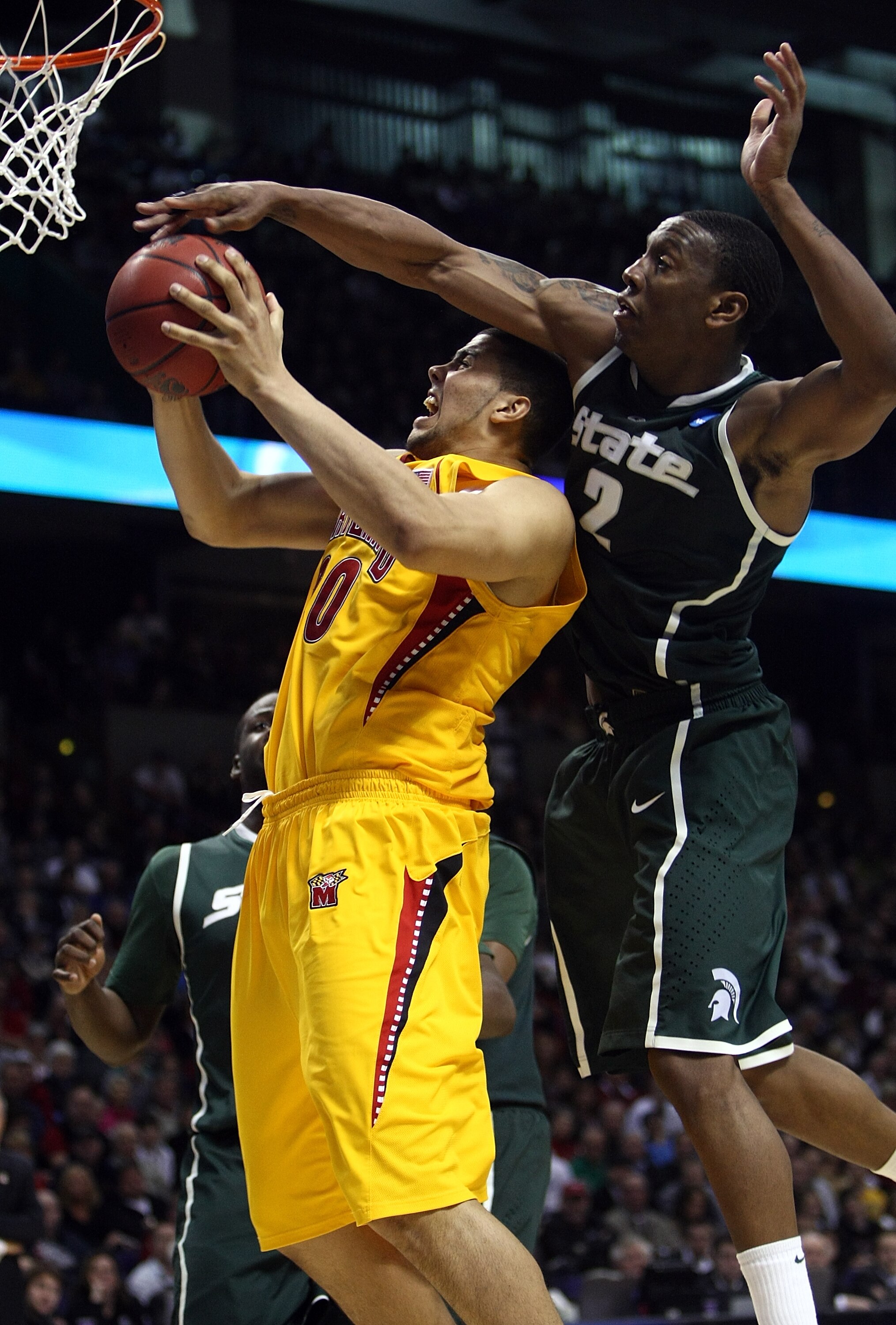 SPOKANE, WA - MARCH 21:  Jordan Williams #20 of the Maryland Terrapins is blocked by Raymar Morgan #2 of the Michigan State Spartans during the second round of the 2010 NCAA men's basketball tournament at Spokane Arena on March 21, 2010 in Spokane, Washin