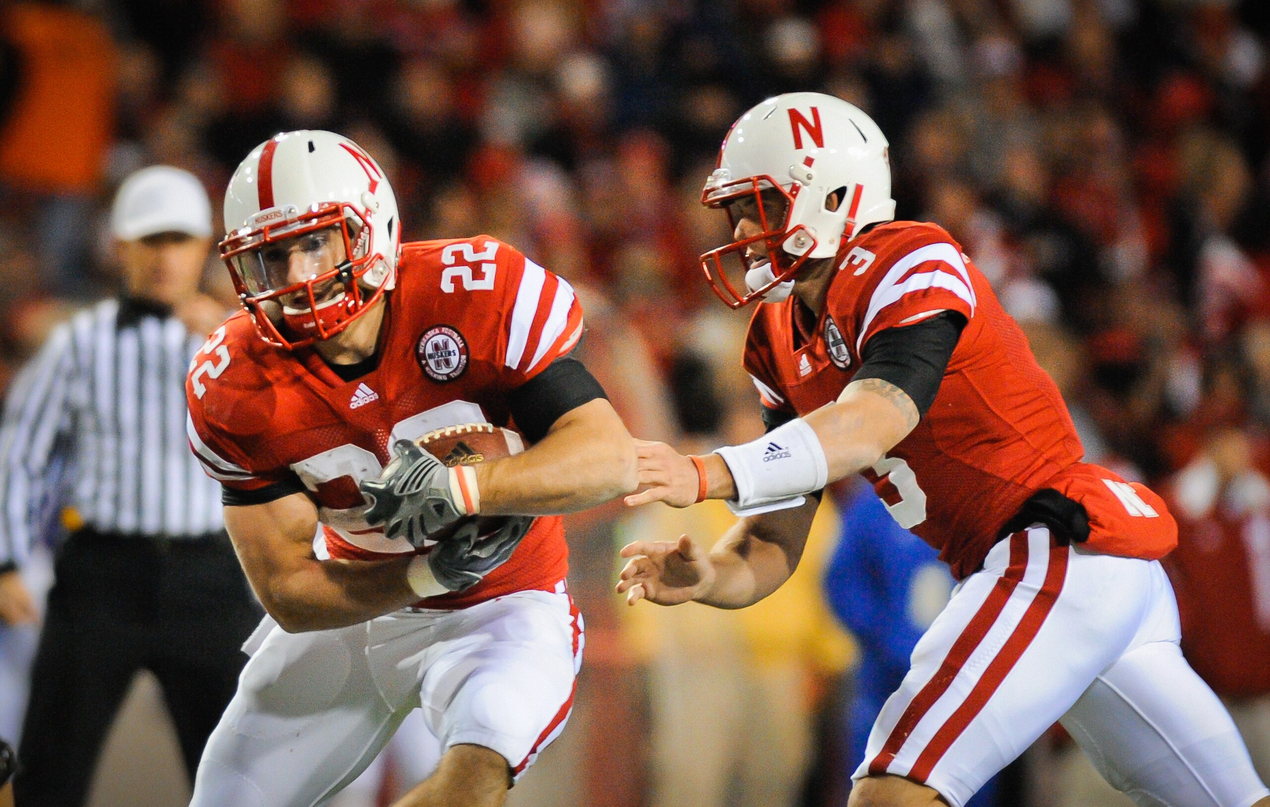 LINCOLN, NE - NOVEMBER 13: Taylor Martinez #3 of the Nebraska Cornhuskers hands the ball to Rex Burkhead #22 during second half action of their game at Memorial Stadium on November 13, 2010 in Lincoln, Nebraska. Nebraska Defeated Kansas 20-3. (Photo by Er LINCOLN, NE - NOVEMBER 13: Taylor Martinez #3 of the Nebraska Cornhuskers hands the ball to Rex Burkhead #22 during second half action of their game at Memorial Stadium on November 13, 2010 in Lincoln, Nebraska. Nebraska Defeated Kansas 20-3. (Photo by Er