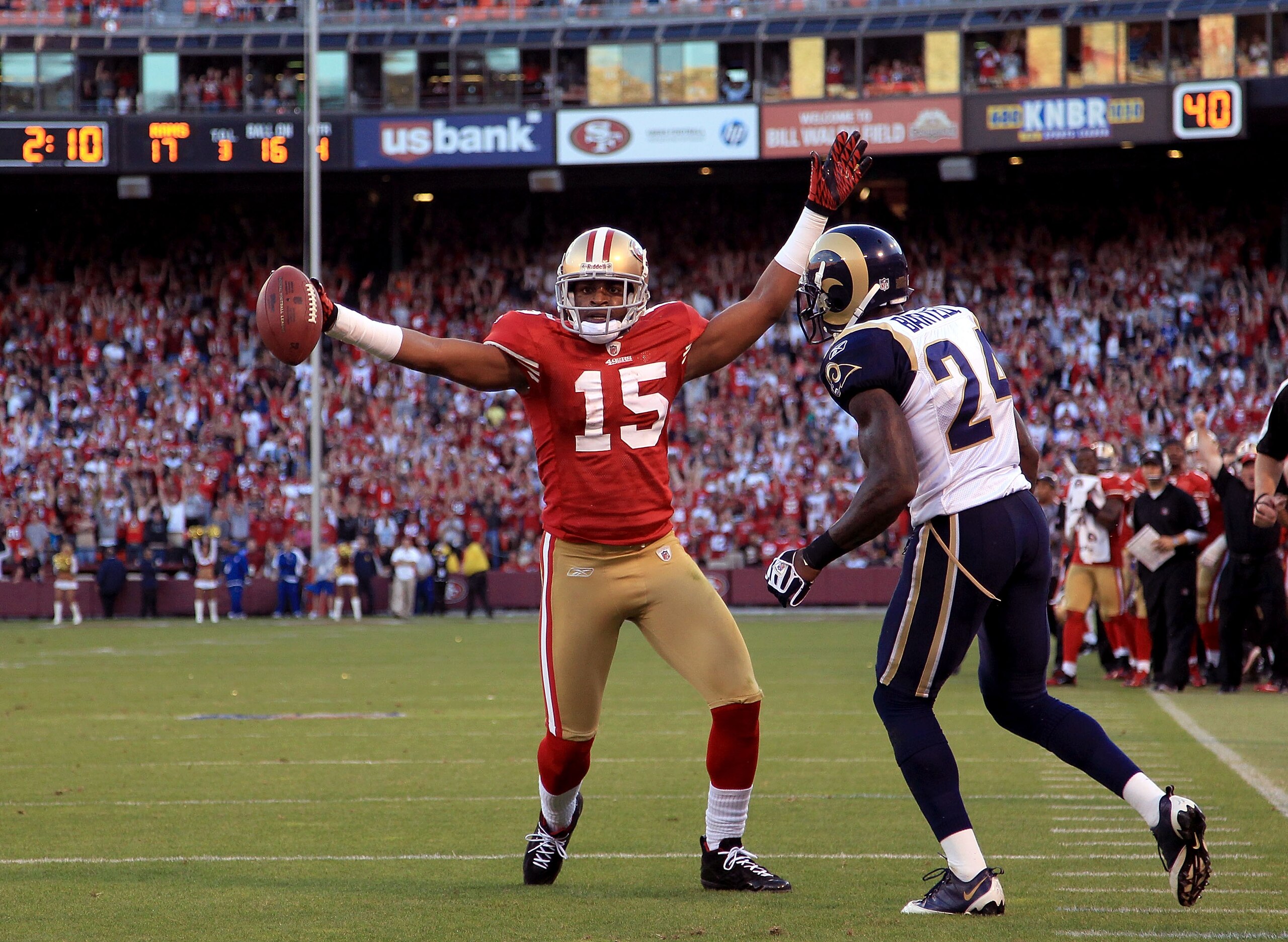 SAN FRANCISCO - NOVEMBER 14: Michael Crabtree #15 of the San Francisco 49ers celebrates after scoring a touchdown while defended by Ron Bartell #24 of the St. Louis Rams at Candlestick Park on November 14, 2010 in San Francisco, California. (Photo by Ez SAN FRANCISCO - NOVEMBER 14: Michael Crabtree #15 of the San Francisco 49ers celebrates after scoring a touchdown while defended by Ron Bartell #24 of the St. Louis Rams at Candlestick Park on November 14, 2010 in San Francisco, California. (Photo by Ez