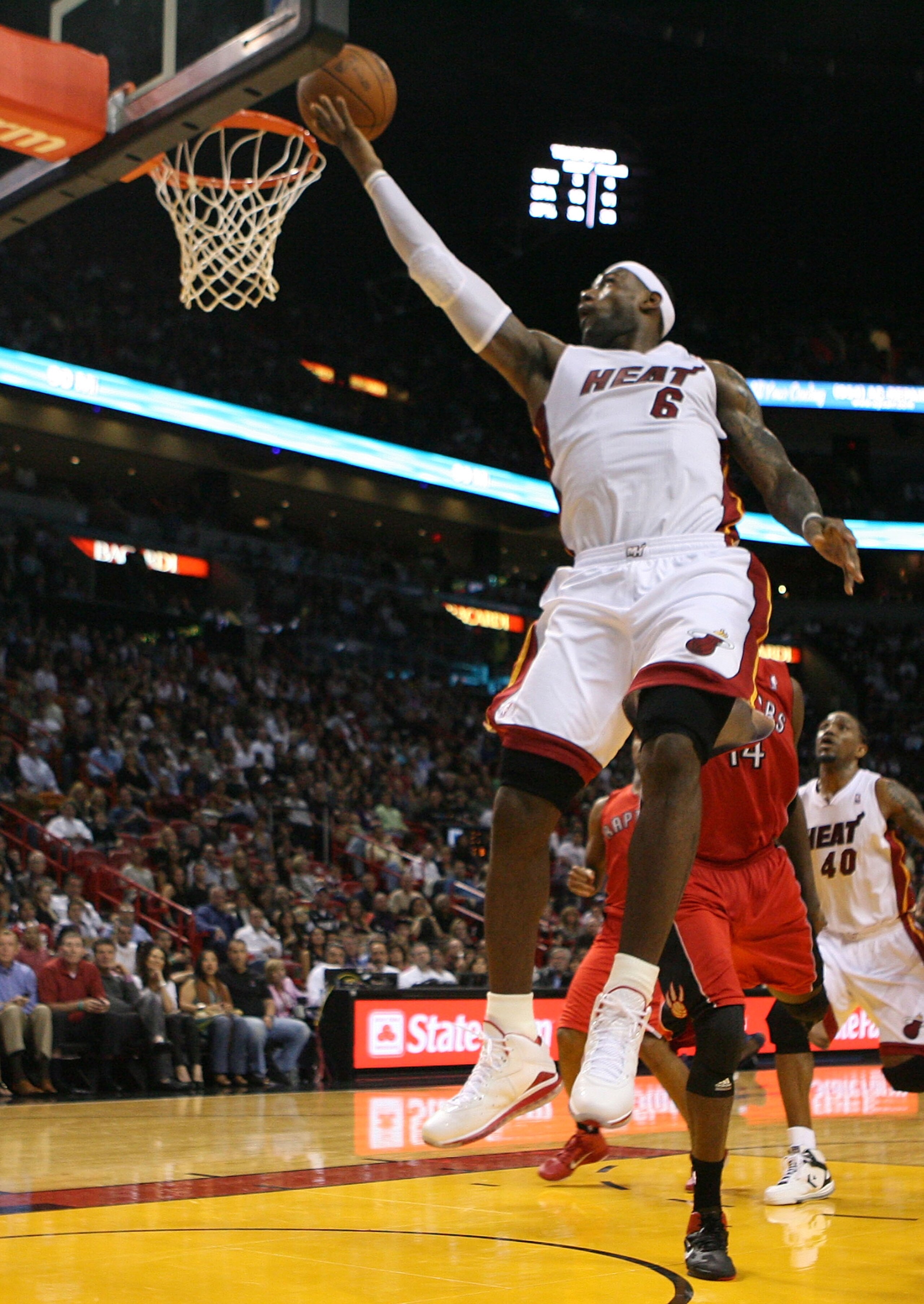 MIAMI - NOVEMBER 13:  Forward LeBron James #6 of the Miami Heat scores against the Toronto Raptors at American Airlines Arena on November 13, 2010 in Miami, Florida. NOTE TO USER: User expressly acknowledges and agrees that, by downloading and or using th