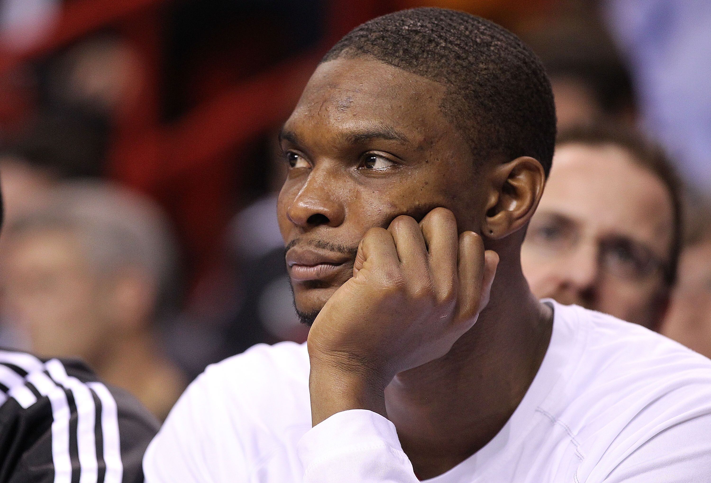 MIAMI - NOVEMBER 11:  Chris Bosh #1 of the Miami Heat waits on the bench during a game against the Boston Celtics at American Airlines Arena on November 11, 2010 in Miami, Florida. NOTE TO USER: User expressly acknowledges and agrees that, by downloading 