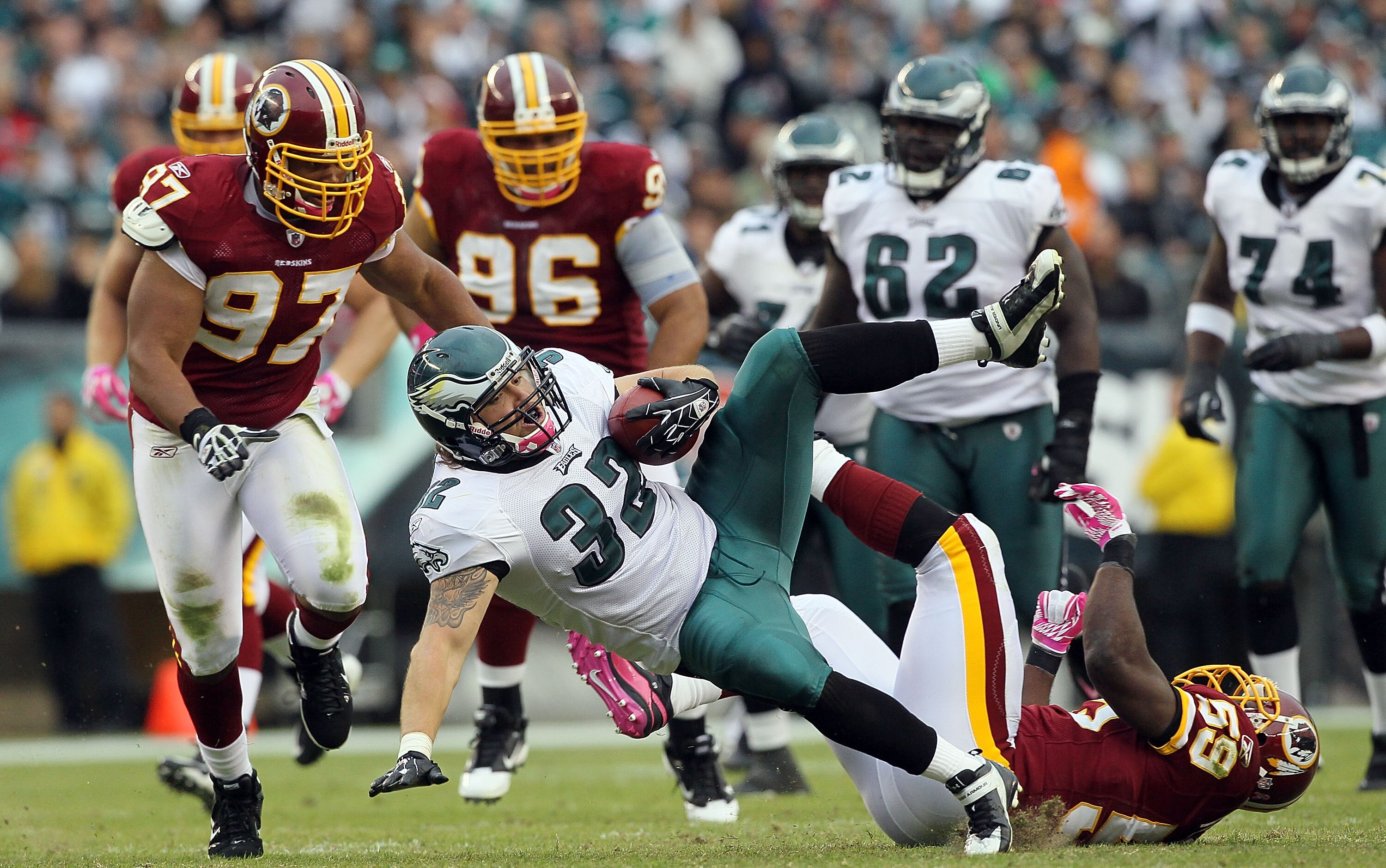PHILADELPHIA - OCTOBER 03:  Owen Schmitt #32 of the Philadelphia Eagles is taken down by London Fletcher #59 of the Washington Redskins on October 3, 2010 at Lincoln Financial Field in Philadelphia, Pennsylvania.  (Photo by Jim McIsaac/Getty Images)