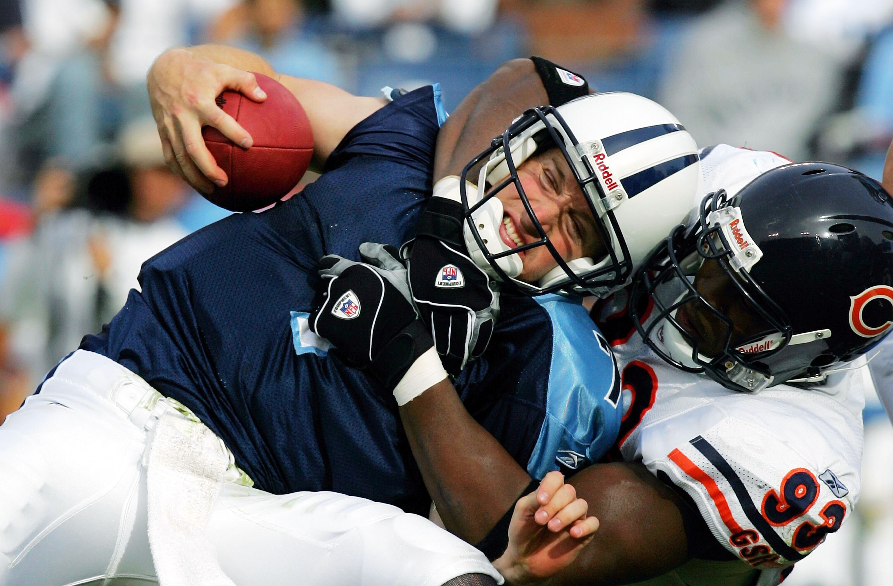 NASHVILLE - NOVEMBER 14: Defensive end Adewale Ogunleye #93 of the Chicago Bears sacks Billy Volek #7 of the Tennessee Titans on November 14, 2004 at the Coliseum in Nashville, Tennessee.  The Bears defeated the Titans 19-17 in overtime.  (Photo by Ronald