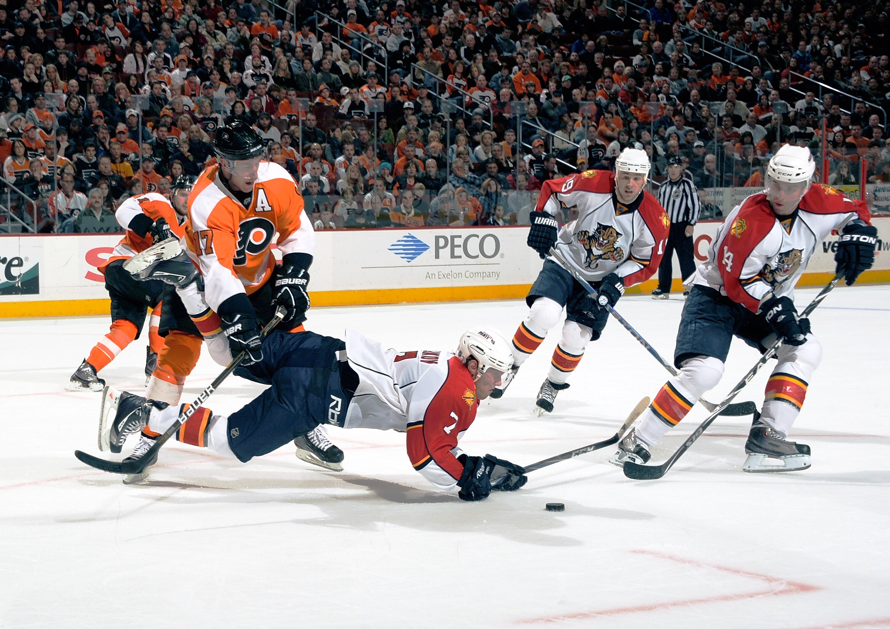 PHILADELPHIA - NOVEMBER 13:  Dmitry Kulikov #7 of the Florida Panthers tripped by Jeff Carter #17 of the Philadelphia Flyers on November 13, 2010 in Philadelphia, Pennsylvania. The Flyers went on to defeat the Panthers 5-2. (Photo by Lou Capozzola/Getty I