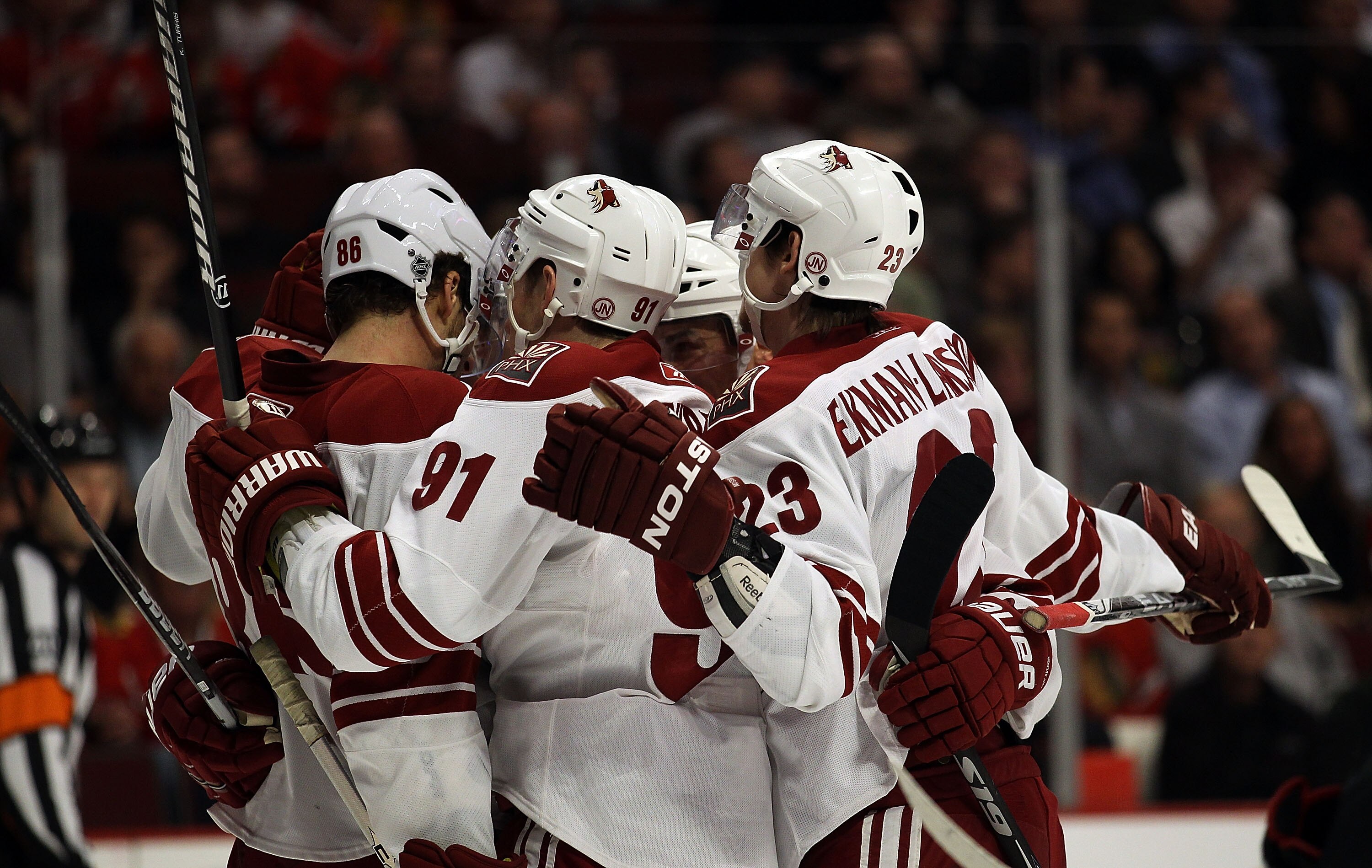 CHICAGO - NOVEMBER 10: Members of the Phoenix Coyotes including Wojtek Wolski #86, Kyle Turris #91 and Oliver Ekman-Larsson #23 celebrate a 2nd period goal against the Chicago Blackhawks at the United Center on November 10, 2010 in Chicago, Illinois.  (Ph