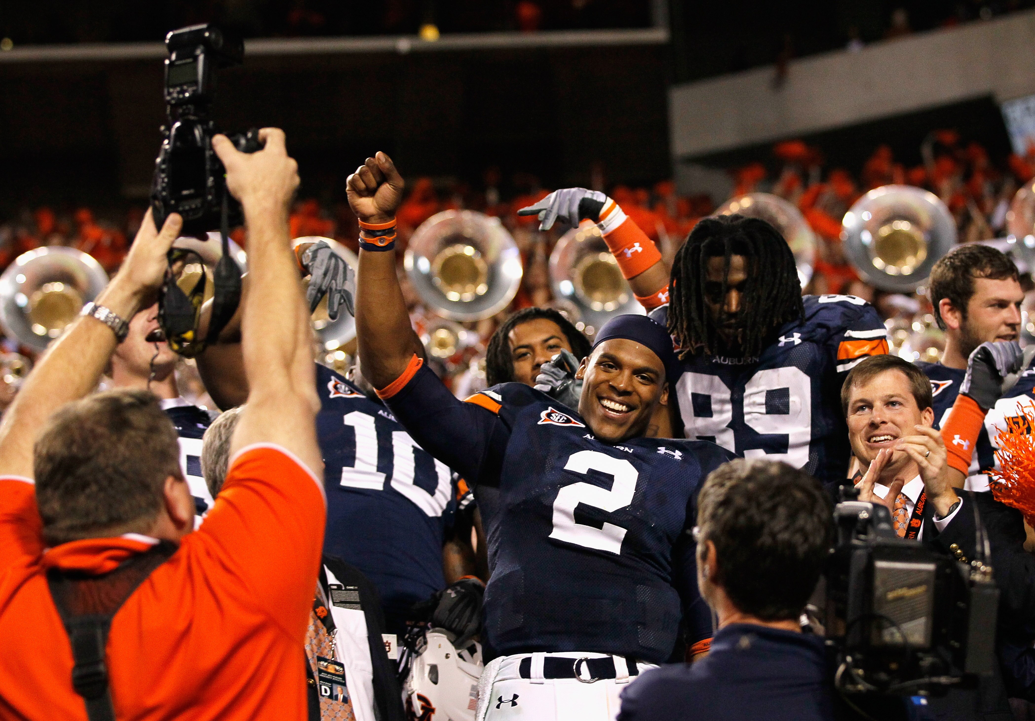 AUBURN, AL - NOVEMBER 13:  Quarterback Cameron Newton #2 of the Auburn Tigers celebrates with fans after their 49-31 win over the Georgia Bulldogs at Jordan-Hare Stadium on November 13, 2010 in Auburn, Alabama.  (Photo by Kevin C. Cox/Getty Images)