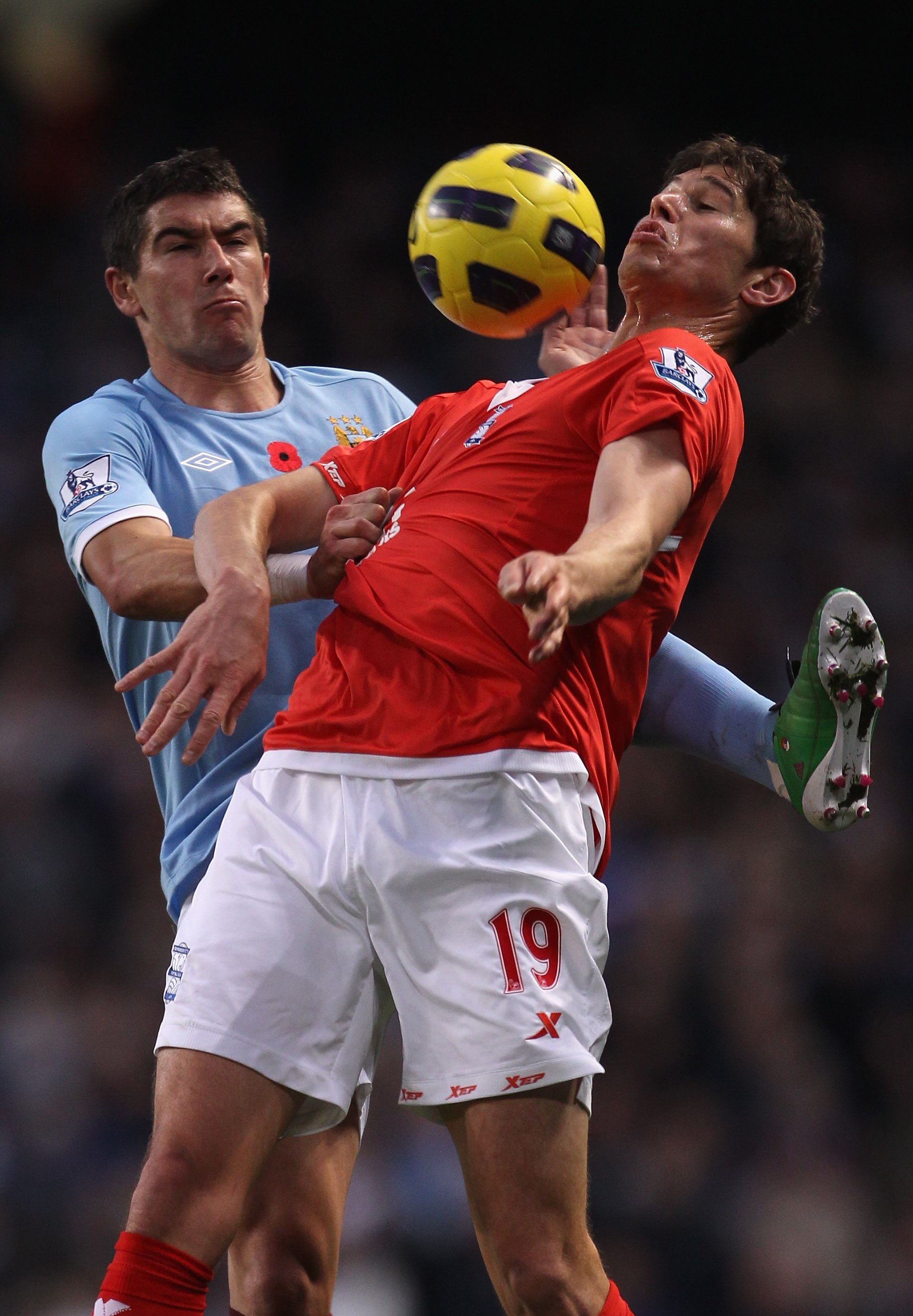 MANCHESTER, ENGLAND - NOVEMBER 13: Nikola Zigic of Birmingham City holds off a challenge from Aleksandar Kolarov of Manchester City during the Barclays Premier League match between Manchester City and Birmingham City at City of Manchester Stadium on Nove MANCHESTER, ENGLAND - NOVEMBER 13: Nikola Zigic of Birmingham City holds off a challenge from Aleksandar Kolarov of Manchester City during the Barclays Premier League match between Manchester City and Birmingham City at City of Manchester Stadium on Nove