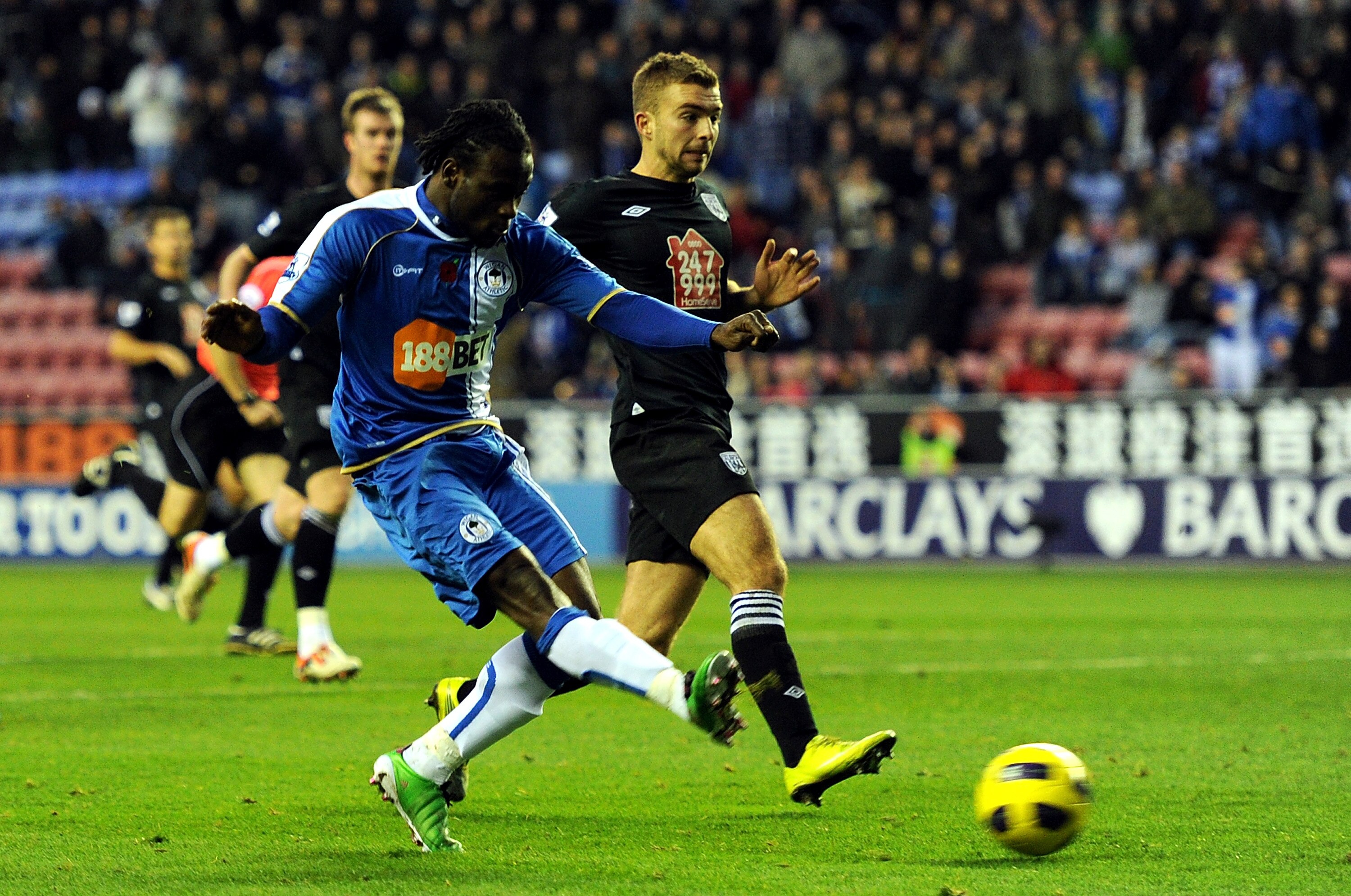 WIGAN, ENGLAND - NOVEMBER 13: Victor Moses of Wigan Athletic scores the opening goal during the Barclays Premier League match between Wigan Athletic and West Bromwich Albion at DW Stadium on November 13, 2010 in Wigan, England. (Photo by Chris Brunskill WIGAN, ENGLAND - NOVEMBER 13: Victor Moses of Wigan Athletic scores the opening goal during the Barclays Premier League match between Wigan Athletic and West Bromwich Albion at DW Stadium on November 13, 2010 in Wigan, England. (Photo by Chris Brunskill