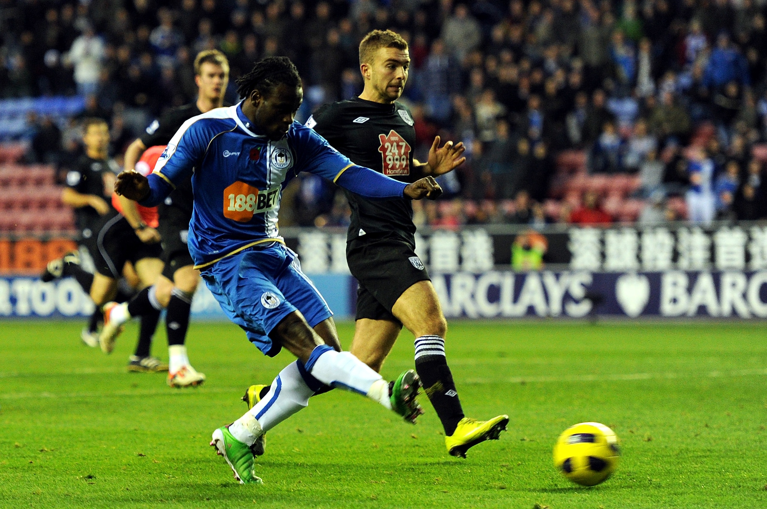 WIGAN, ENGLAND - NOVEMBER 13:  Victor Moses of Wigan Athletic scores the opening goal during the Barclays Premier League match between Wigan Athletic and West Bromwich Albion at DW Stadium on November 13, 2010 in Wigan, England.  (Photo by Chris Brunskill