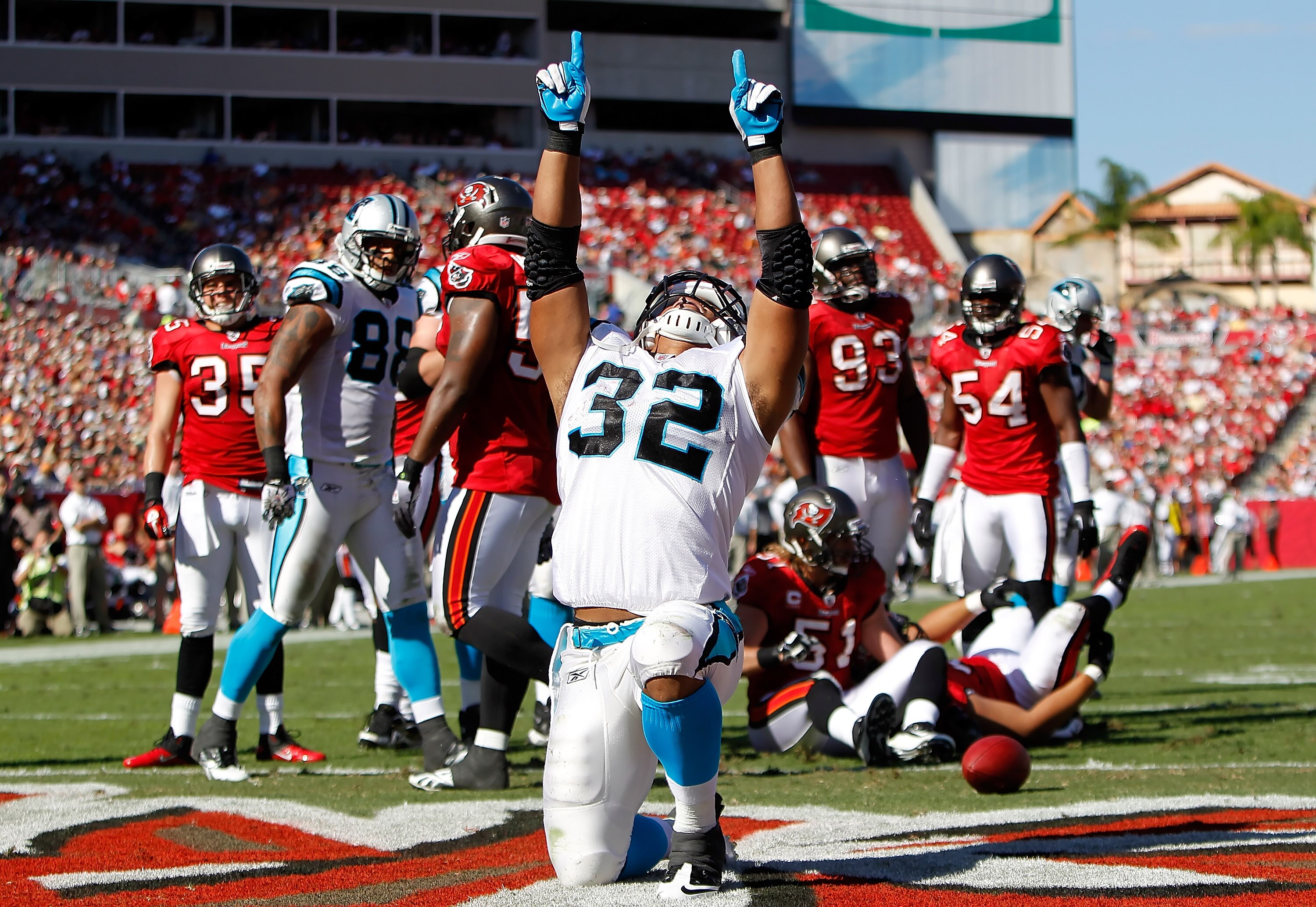 TAMPA, FL - NOVEMBER 14:  Running back Josh Vaughan #32 of the Carolina Panthers celebrates his second quarter touchdown against the Tampa Bay Buccaneers during the game at Raymond James Stadium on November 14, 2010 in Tampa, Florida.  (Photo by J. Meric/