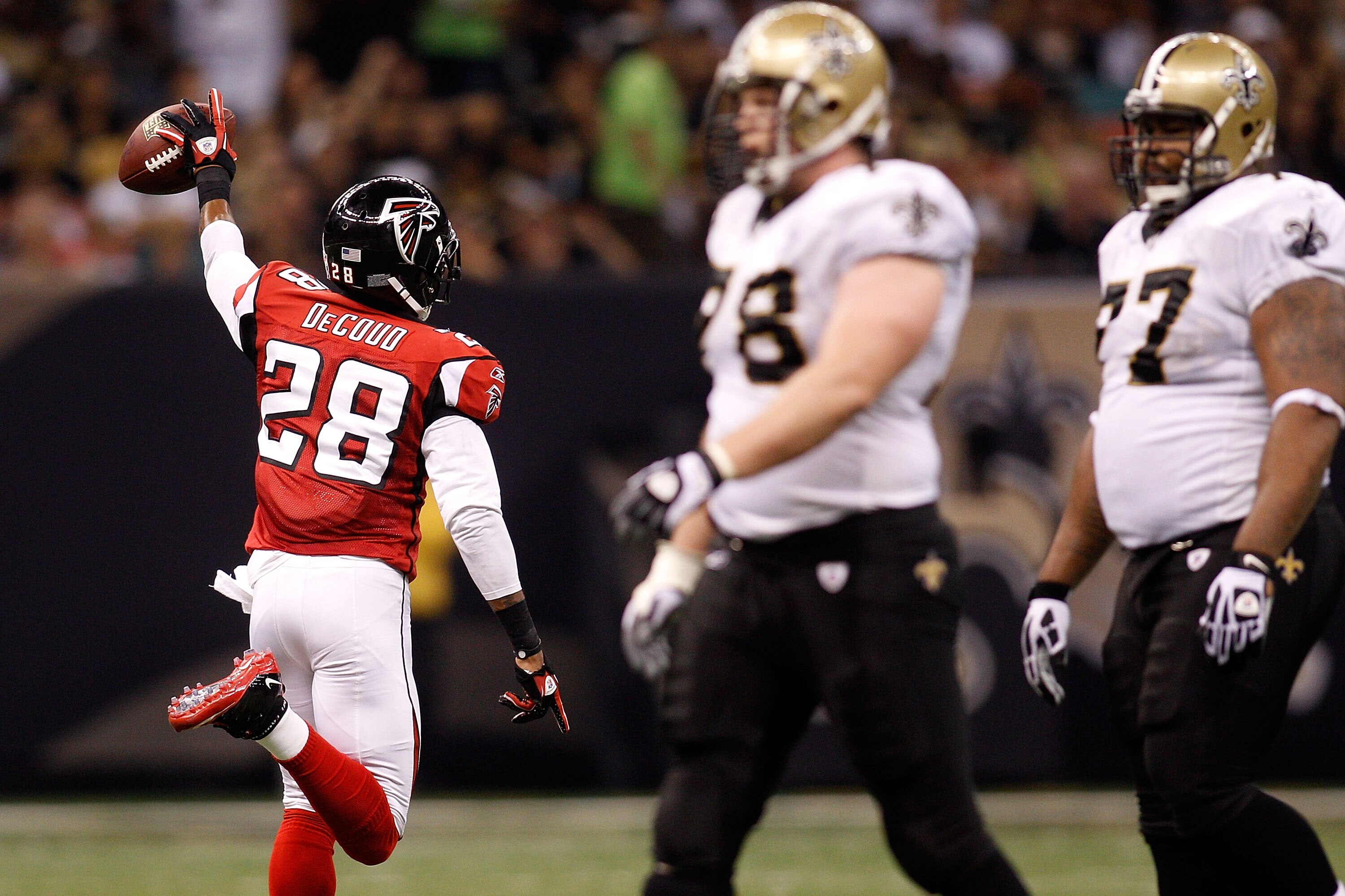 NEW ORLEANS - SEPTEMBER 26:  Thomas DeCoud #28 of the Atlanta Falcons celebrates after making an interception against the New Orleans Saints at the Louisiana Superdome on September 26, 2010 in New Orleans, Louisiana.  (Photo by Chris Graythen/Getty Images