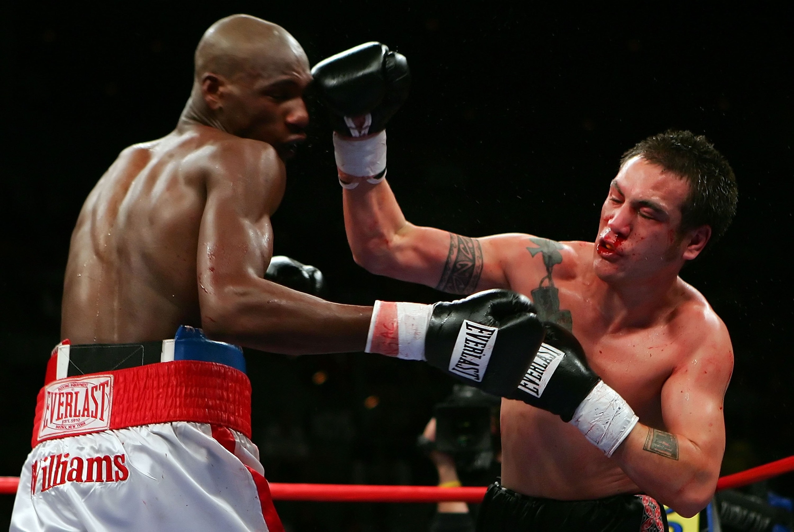 LAS VEGAS - NOVEMBER 04: Santos Pakau (R) of New Zealand connects to the head of Paul Williams during their welterweight fight at the Mandalay Bay Events Center November 4, 2006 in Las Vegas, Nevada. Williams won by TKO in the 7th round. (Photo by Etha LAS VEGAS - NOVEMBER 04: Santos Pakau (R) of New Zealand connects to the head of Paul Williams during their welterweight fight at the Mandalay Bay Events Center November 4, 2006 in Las Vegas, Nevada. Williams won by TKO in the 7th round. (Photo by Etha