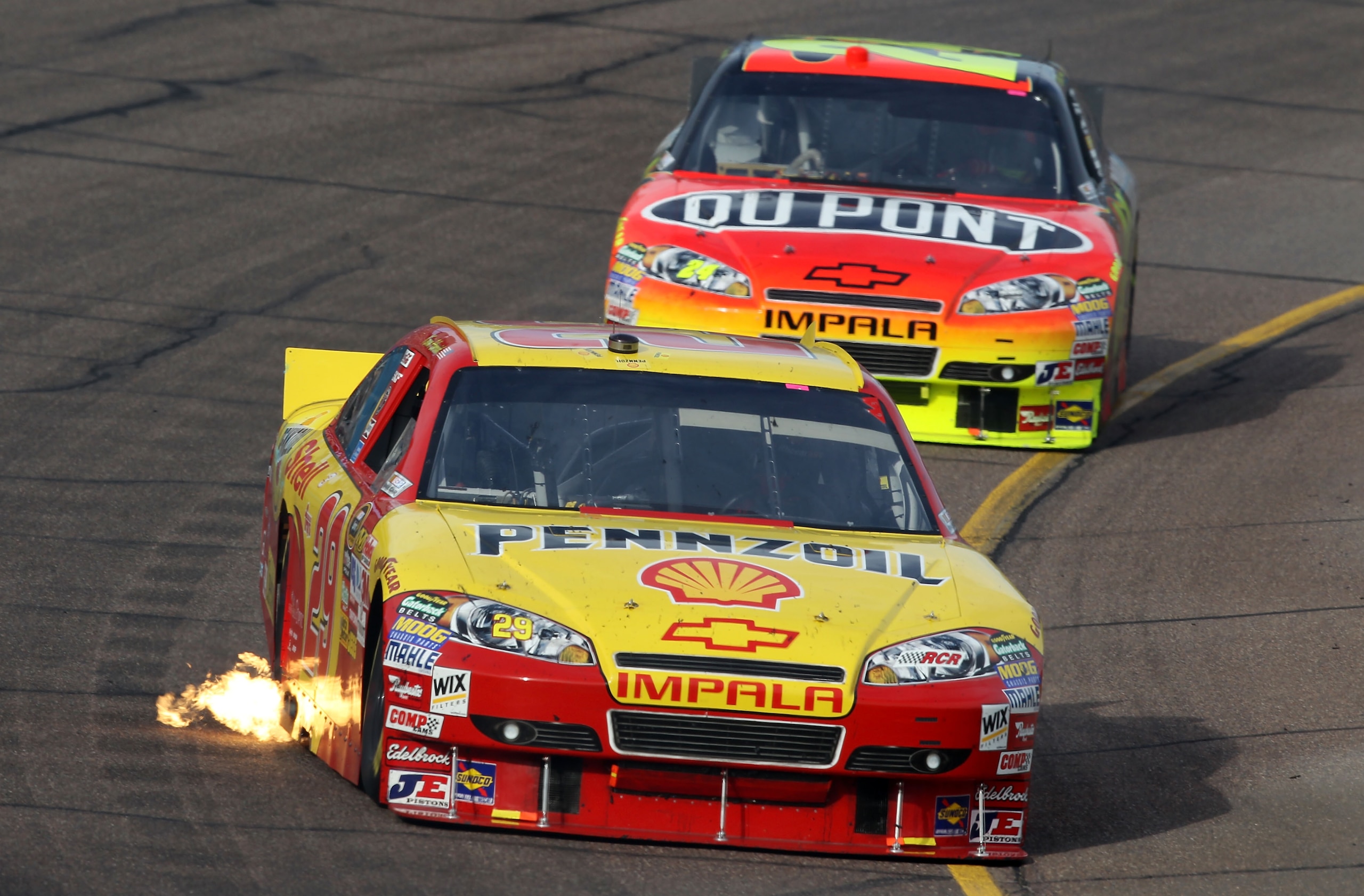 AVONDALE, AZ - NOVEMBER 14: Kevin Harvick, driver of the #29 Shell/Pennzoil Chevrolet, leads Jeff Gordon, driver of the #24 DuPont Chevrolet, during the NASCAR Sprint Cup Series Kobalt Tools 500 at Phoenix International Raceway on November 14, 2010 in Av AVONDALE, AZ - NOVEMBER 14: Kevin Harvick, driver of the #29 Shell/Pennzoil Chevrolet, leads Jeff Gordon, driver of the #24 DuPont Chevrolet, during the NASCAR Sprint Cup Series Kobalt Tools 500 at Phoenix International Raceway on November 14, 2010 in Av