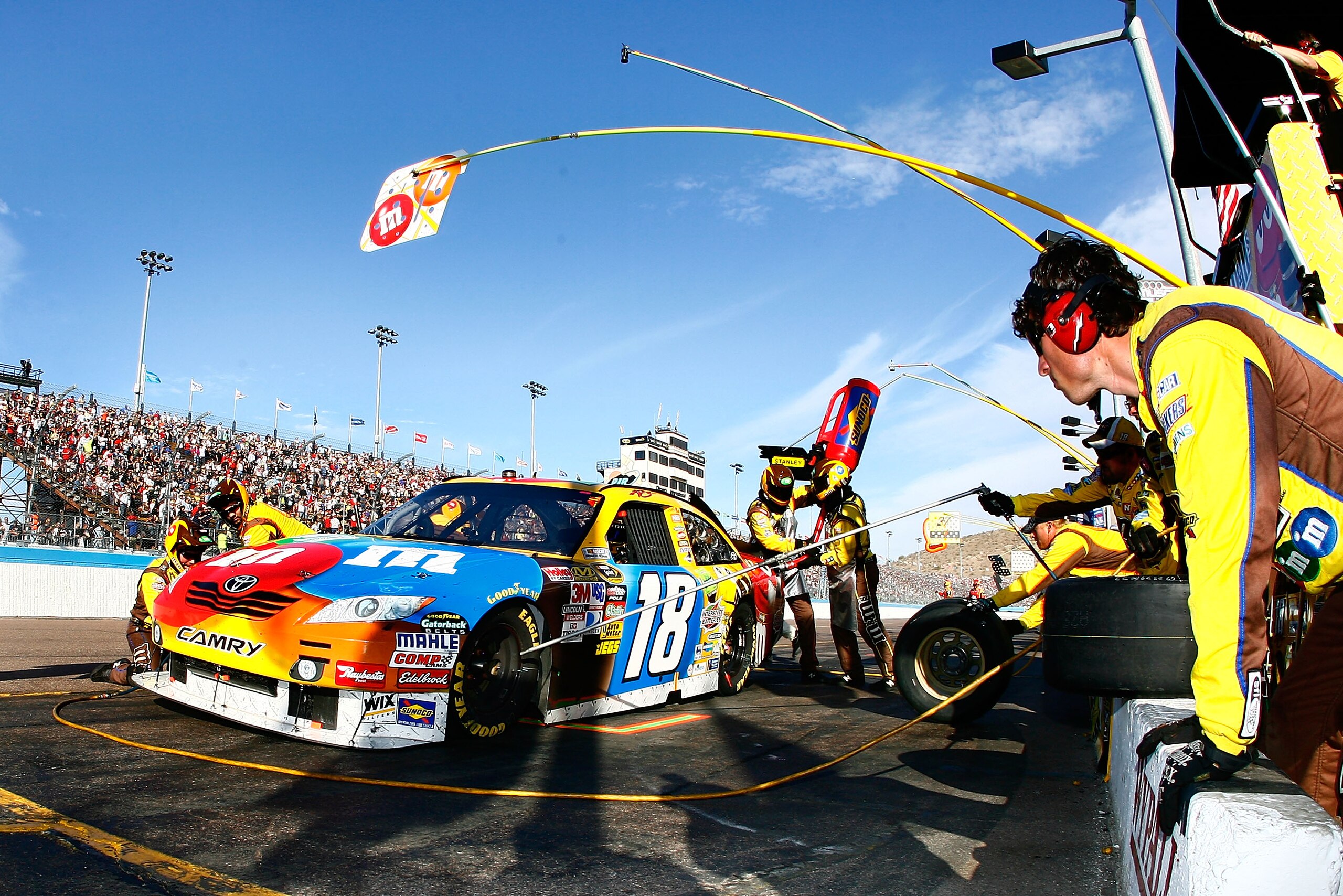 AVONDALE, AZ - NOVEMBER 14: Kyle Busch, driver of the #18 M&M'sToyota, makes a pit stop during the NASCAR Sprint Cup Series Kobalt Tools 500 at Phoenix International Raceway on November 14, 2010 in Avondale, Arizona. (Photo by Jason Smith/Getty Images f AVONDALE, AZ - NOVEMBER 14: Kyle Busch, driver of the #18 M&M'sToyota, makes a pit stop during the NASCAR Sprint Cup Series Kobalt Tools 500 at Phoenix International Raceway on November 14, 2010 in Avondale, Arizona. (Photo by Jason Smith/Getty Images f