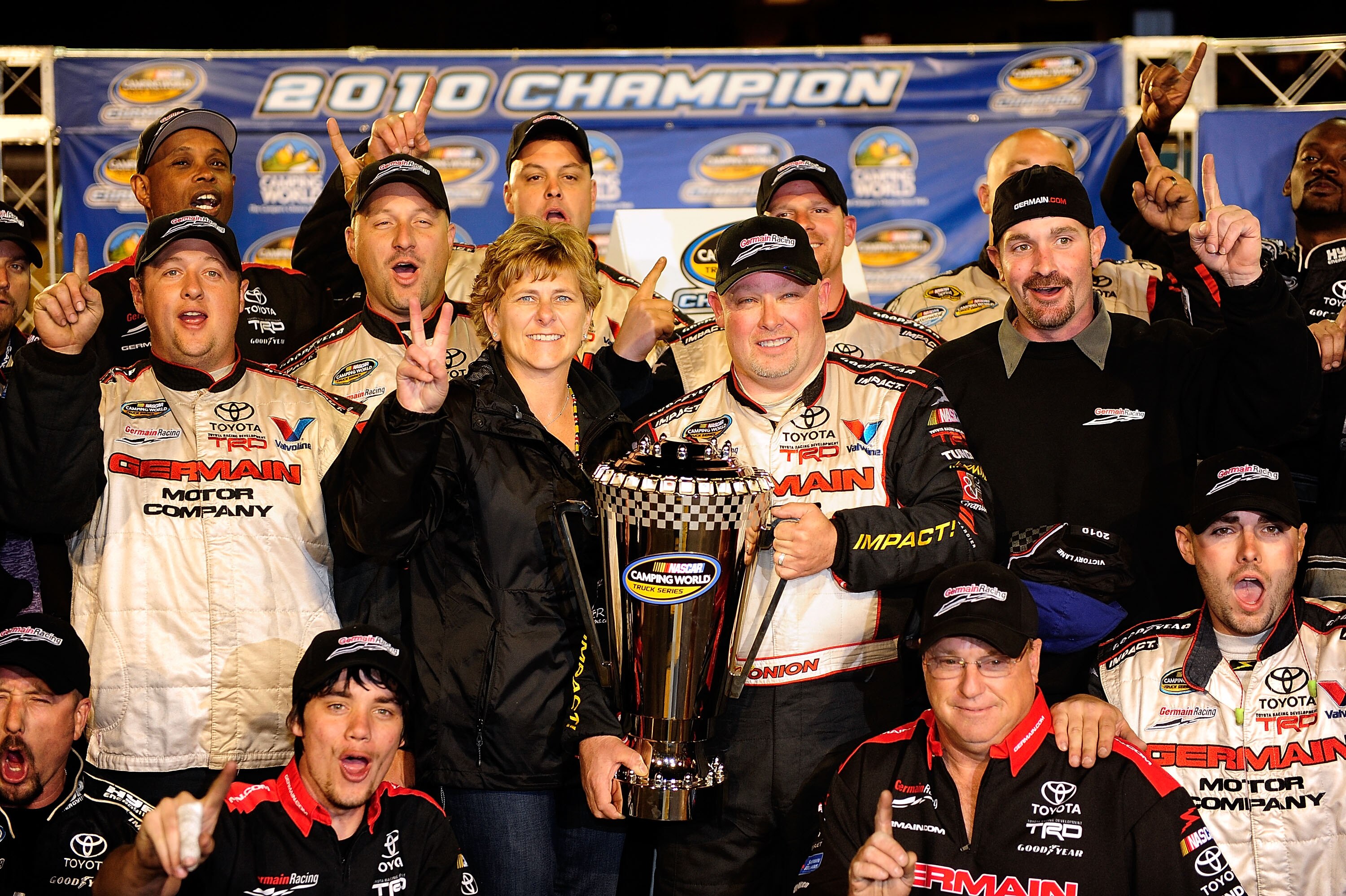 AVONDALE, AZ - NOVEMBER 12:  Todd Bodine, driver of the #30 Germain.com Toyota, celebrates clinching the NASCAR Camping World Truck Series championship with his team after finishing 12th in the Lucas Oil 150 at Phoenix International Raceway on November 12