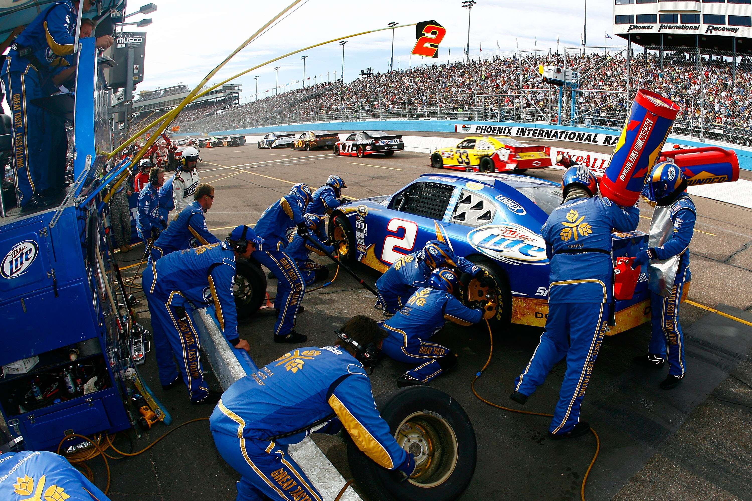 AVONDALE, AZ - NOVEMBER 14:  Kurt Busch, driver of the #2 Miller Lite Dodge, makes a pit stop during the NASCAR Sprint Cup Series Kobalt Tools 500 at Phoenix International Raceway on November 14, 2010 in Avondale, Arizona.  (Photo by Jason Smith/Getty Ima