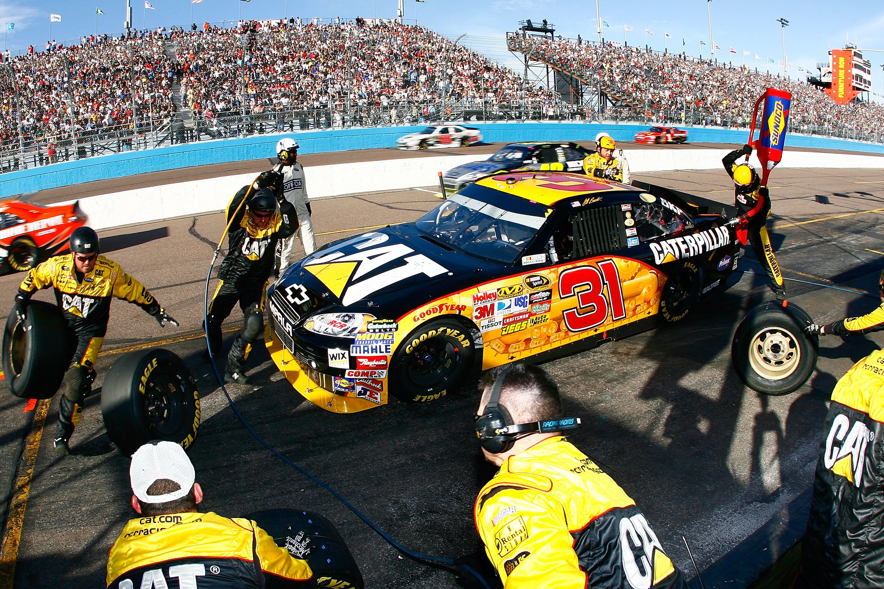 AVONDALE, AZ - NOVEMBER 14:  Jeff Burton, driver of the #31 Caterpilliar Chevrolet, makes a pit stop during the NASCAR Sprint Cup Series Kobalt Tools 500 at Phoenix International Raceway on November 14, 2010 in Avondale, Arizona.  (Photo by Jason Smith/Ge