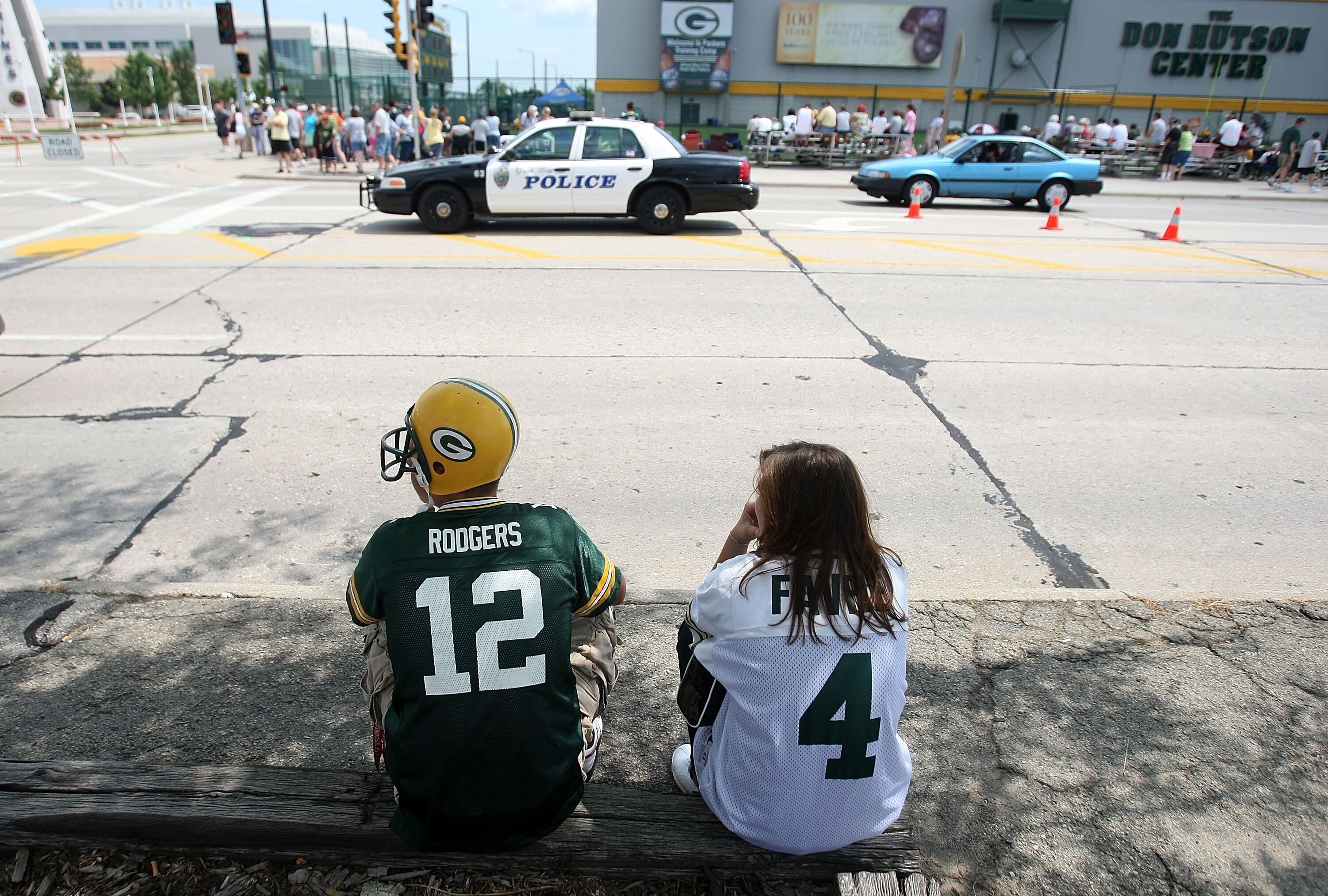 GREEN BAY, WI - AUGUST 05: Two fans, one wearing an Aaron Rodgers jersey and one wearing a Brett Favre jersey, wait for the start of practice at the Green Bay Packers summer training camp on August 5, 2008 at the Hutson Center in Green Bay, Wisconsin. (Ph