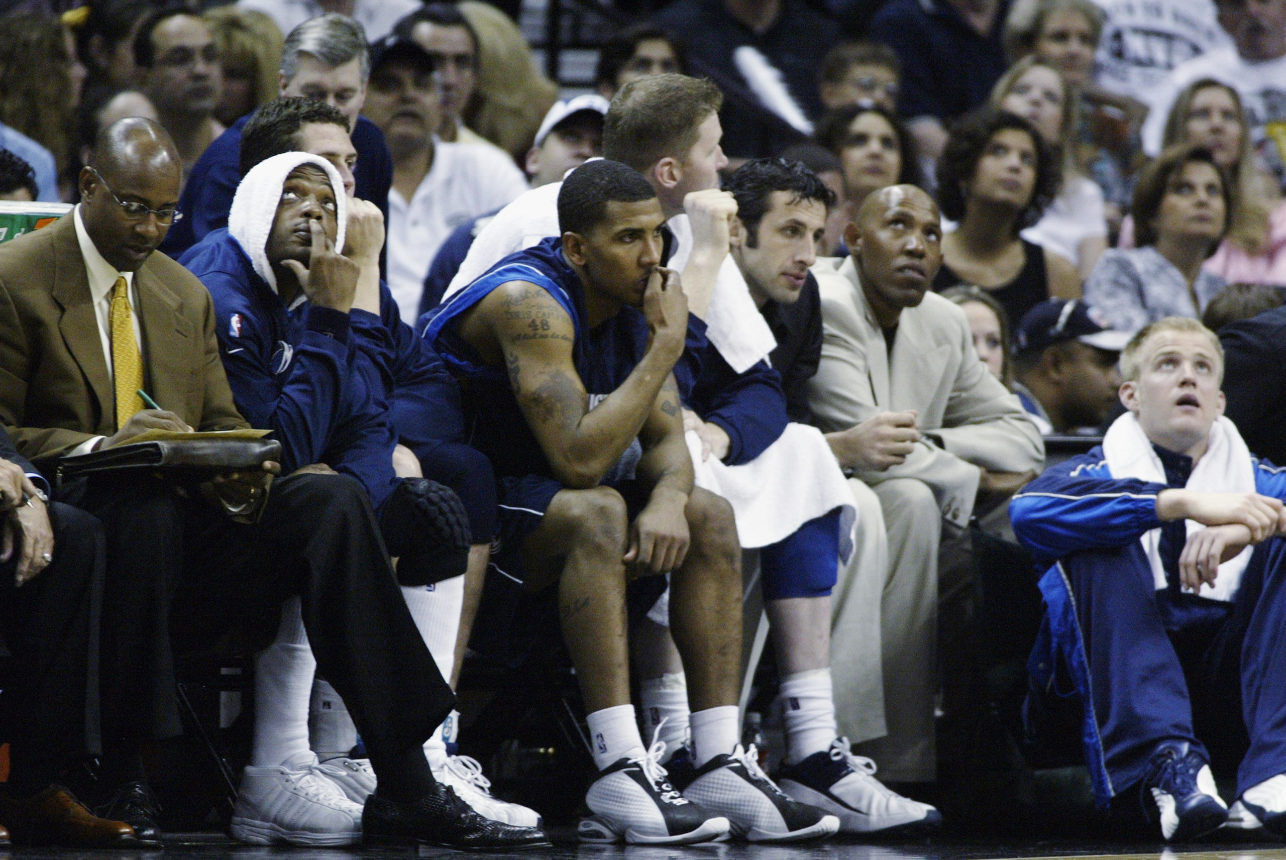SAN ANTONIO - MAY 21:  (L-R) Assistant coach Sidney Moncrief, Nick Van Exel #31, Raef LaFrentz #45, Raja Bell #1, Shawn Bradley #44, Antoine Rigaudeau #17, Popeye Jones #54 and Evan Eschmeyer #42 of the Dallas Mavericks watch the action from the bench in 