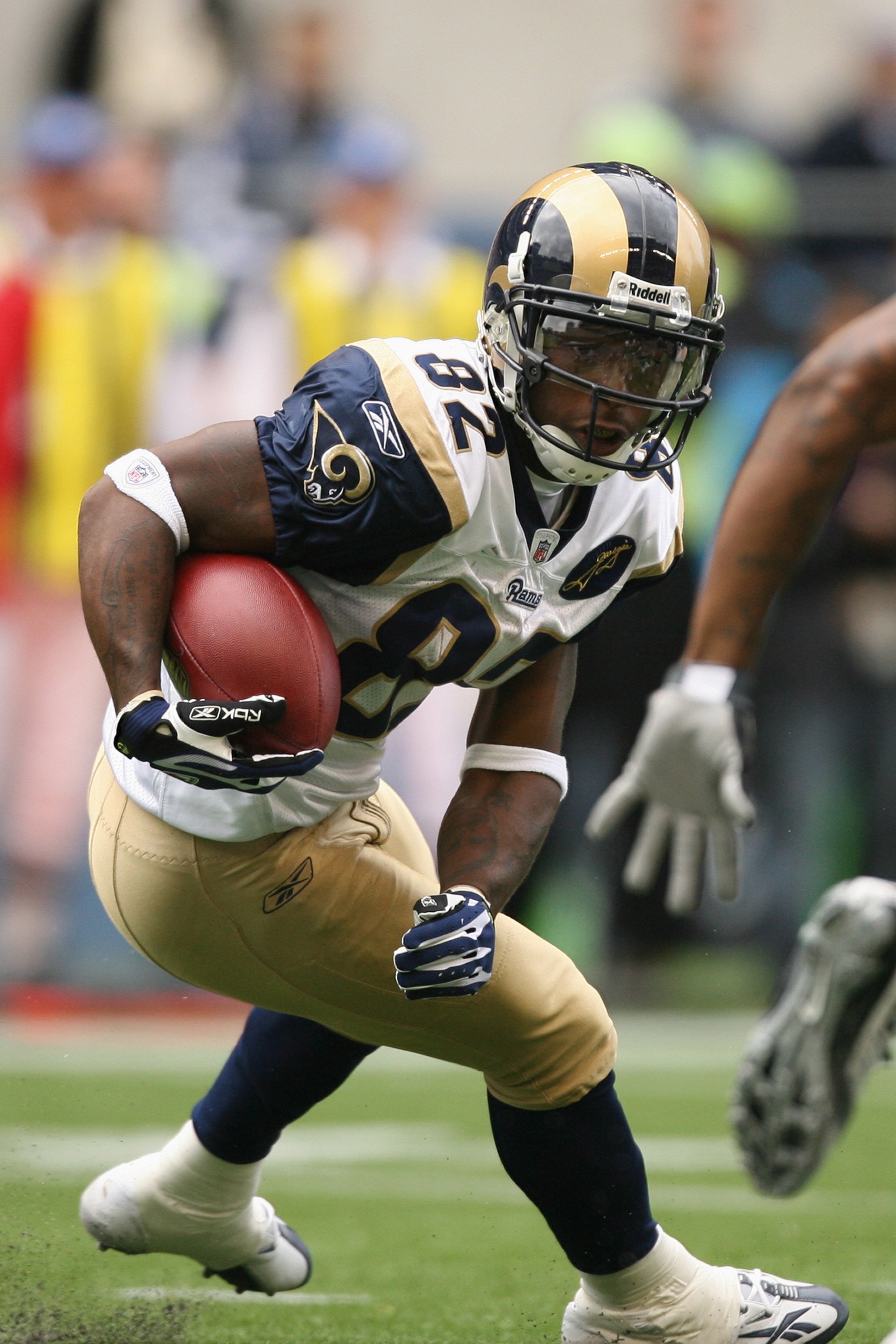SEATTLE - SEPTEMBER 21:  Dante Hall #82 of the St. Louis Rams carries the ball during the game against the Seattle Seahawks on September 21, 2008 at Qwest Field in Seattle, Washington. (Photo by Otto Greule Jr/Getty Images)