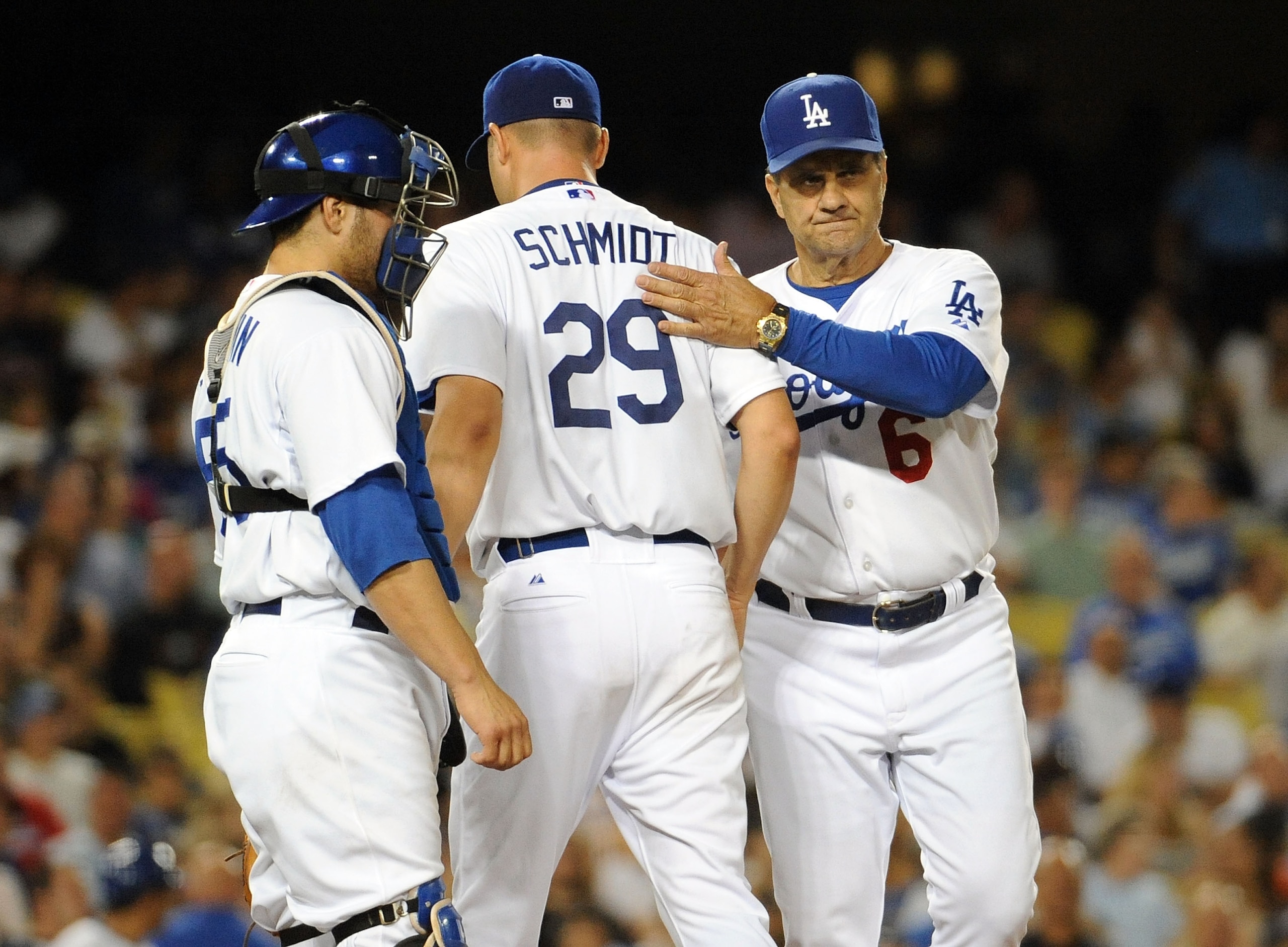 LOS ANGELES, CA - AUGUST 5: Jason Schmidt #29 of the Los Angeles Dodgers gets pulled from the game by manager Joe Torre #6 in front of Russell Martin #55 against the Milwaukee Brewers during the fourth inning at Dodger Stadium August 5, 2009 in Los Angele LOS ANGELES, CA - AUGUST 5: Jason Schmidt #29 of the Los Angeles Dodgers gets pulled from the game by manager Joe Torre #6 in front of Russell Martin #55 against the Milwaukee Brewers during the fourth inning at Dodger Stadium August 5, 2009 in Los Angele