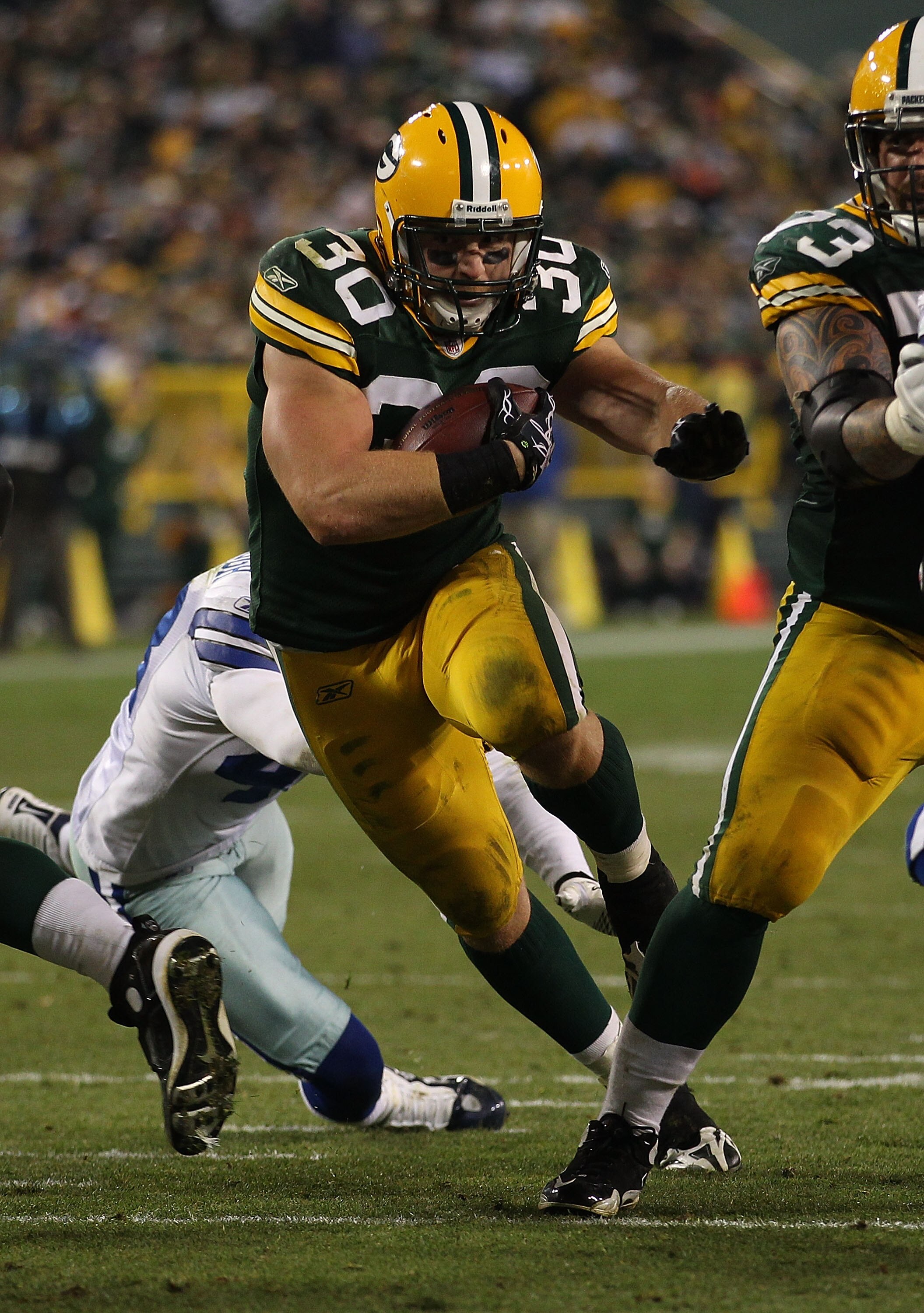 GREEN BAY, WI - NOVEMBER 07: John Kuhn #30 of the Green Bay Packers runs against the Dallas Cowboys at Lambeau Field on November 7, 2010 in Green Bay, Wisconsin. The Packers defeated the Cowboys 45-7. (Photo by Jonathan Daniel/Getty Images)