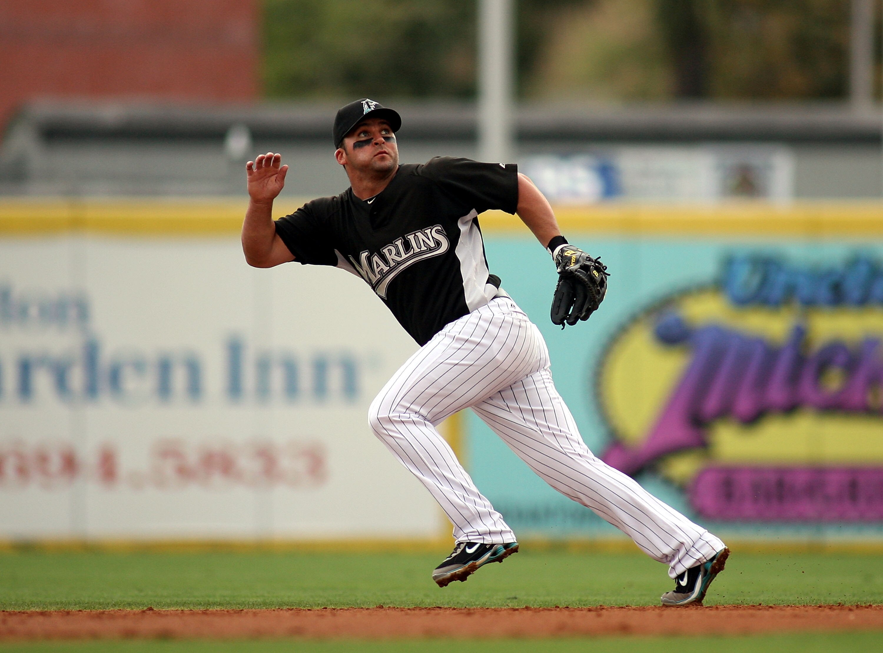 JUPITER, FL - MARCH 28: Second baseman Dan Uggla #6 of the Florida Marlins moves towards the ball  against the Houston Astros on March 28, 2010 at Roger Dean Stadium in Jupiter, Florida.  (Photo by Marc Serota/Getty Images)