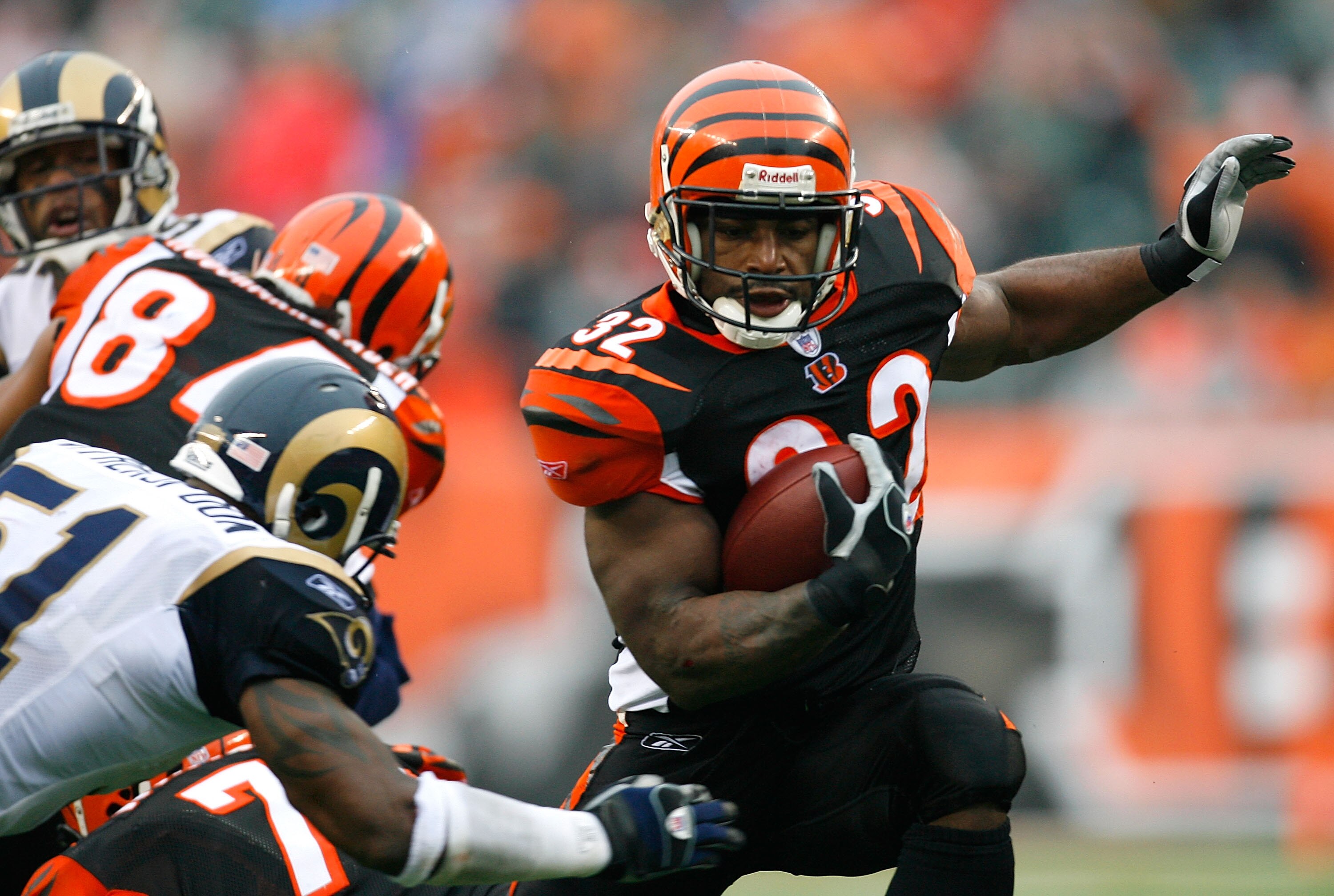 CINCINNATI - DECEMBER 09:  Halfback Rudi Johnson #32 of the Cincinnati Bengals rushes through the St. Louis Rams' defense during the second half at Paul Brown Stadium on December 9, 2007 in Cincinnati, Ohio.  Cincinnati defeated St. Louis 19-10.  (Photo b