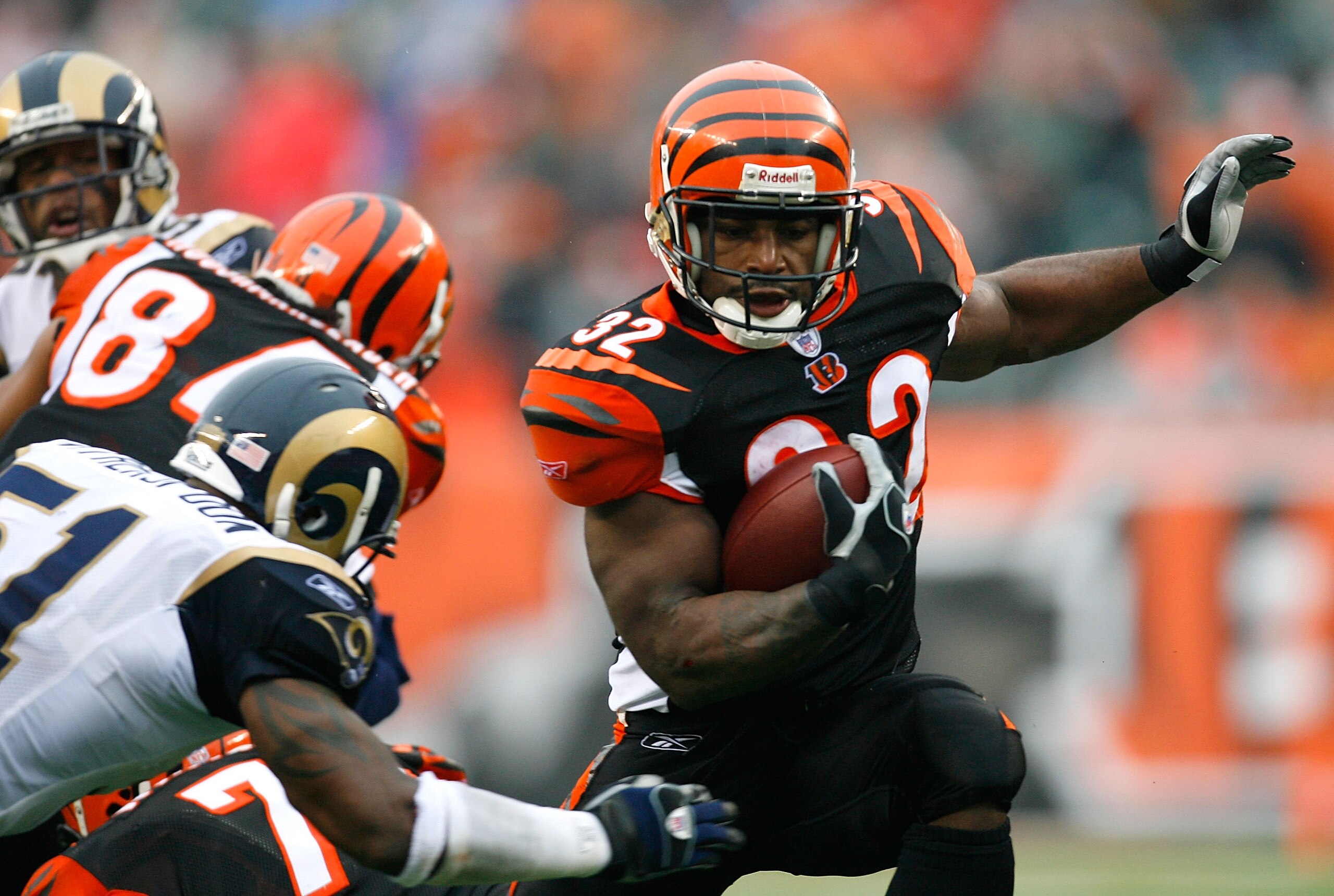 CINCINNATI - DECEMBER 09:  Halfback Rudi Johnson #32 of the Cincinnati Bengals rushes through the St. Louis Rams' defense during the second half at Paul Brown Stadium on December 9, 2007 in Cincinnati, Ohio.  Cincinnati defeated St. Louis 19-10.  (Photo b