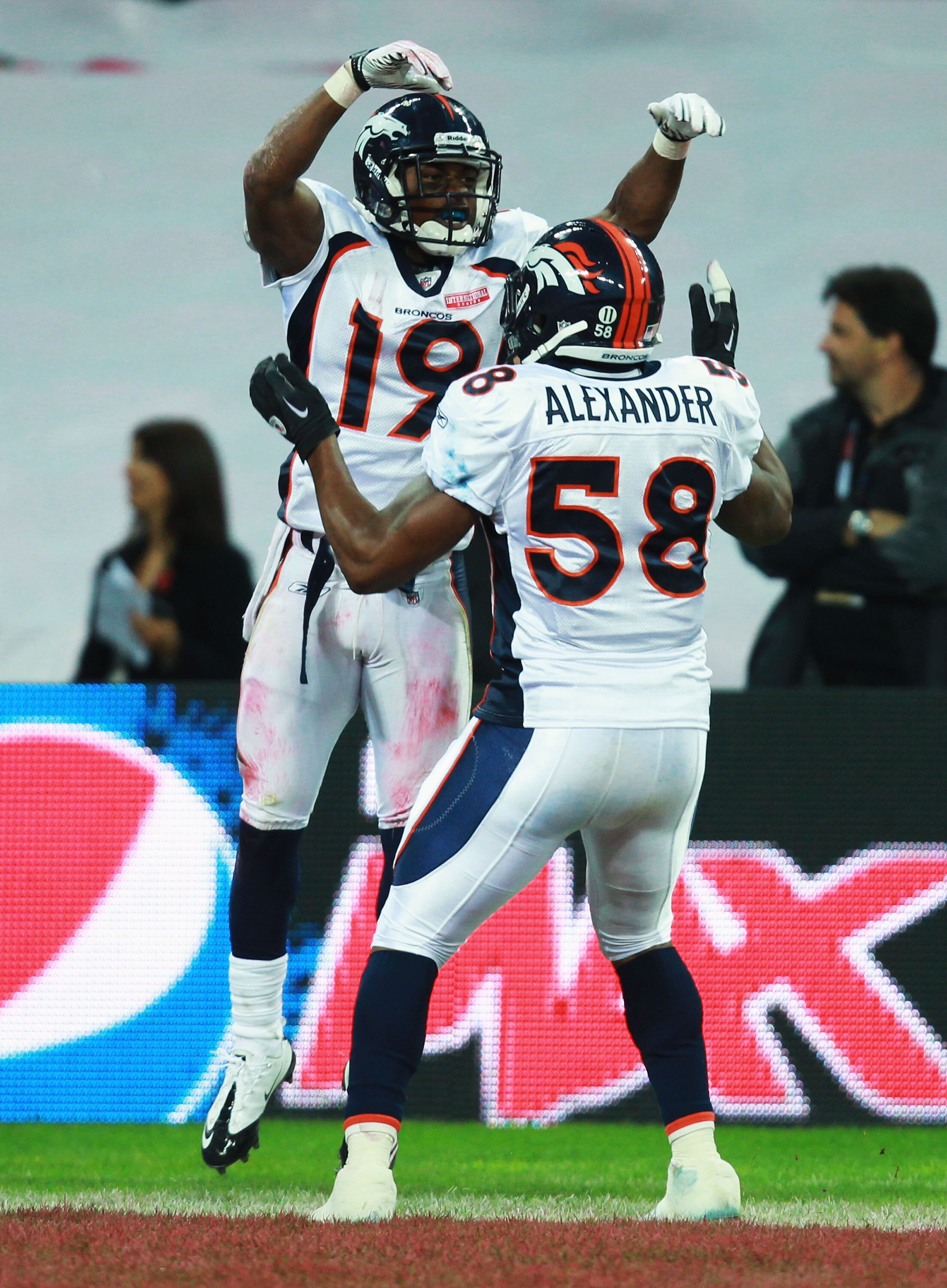 LONDON, ENGLAND - OCTOBER 31:  Eddie Royal #19 of Denver Broncos and Kevin Alexander #58 of Denver Broncos celebrate a touchdown that was subsequently disallowed during the NFL International Series match between Denver Broncos and San Francisco 49ers at W
