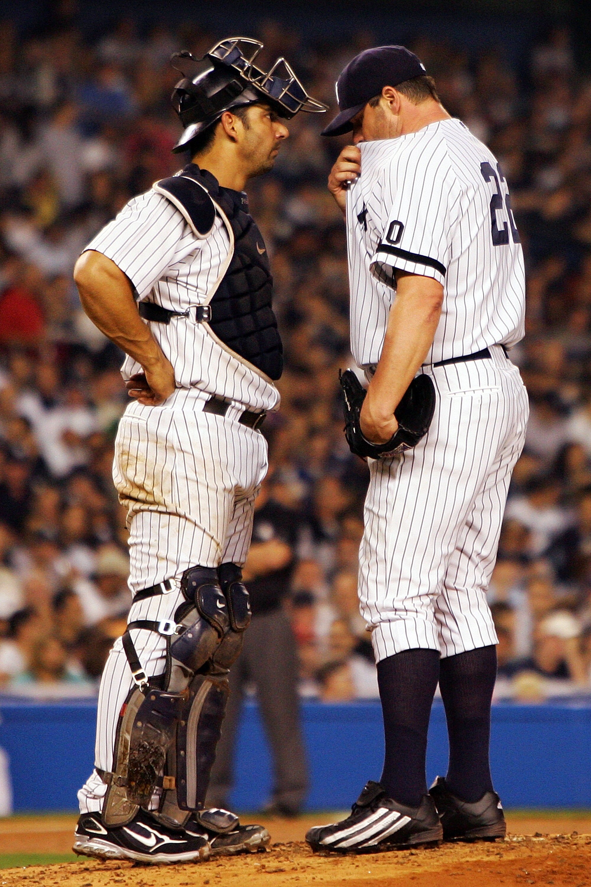 NEW YORK - OCTOBER 07:  Catcher Jorge Posada #20 of the New York Yankees talks with starting pitcher Roger Clemens #22 during Game Three of the American League Division Series against the Cleveland Indians at Yankee Stadium on October 7, 2007 in the Bronx