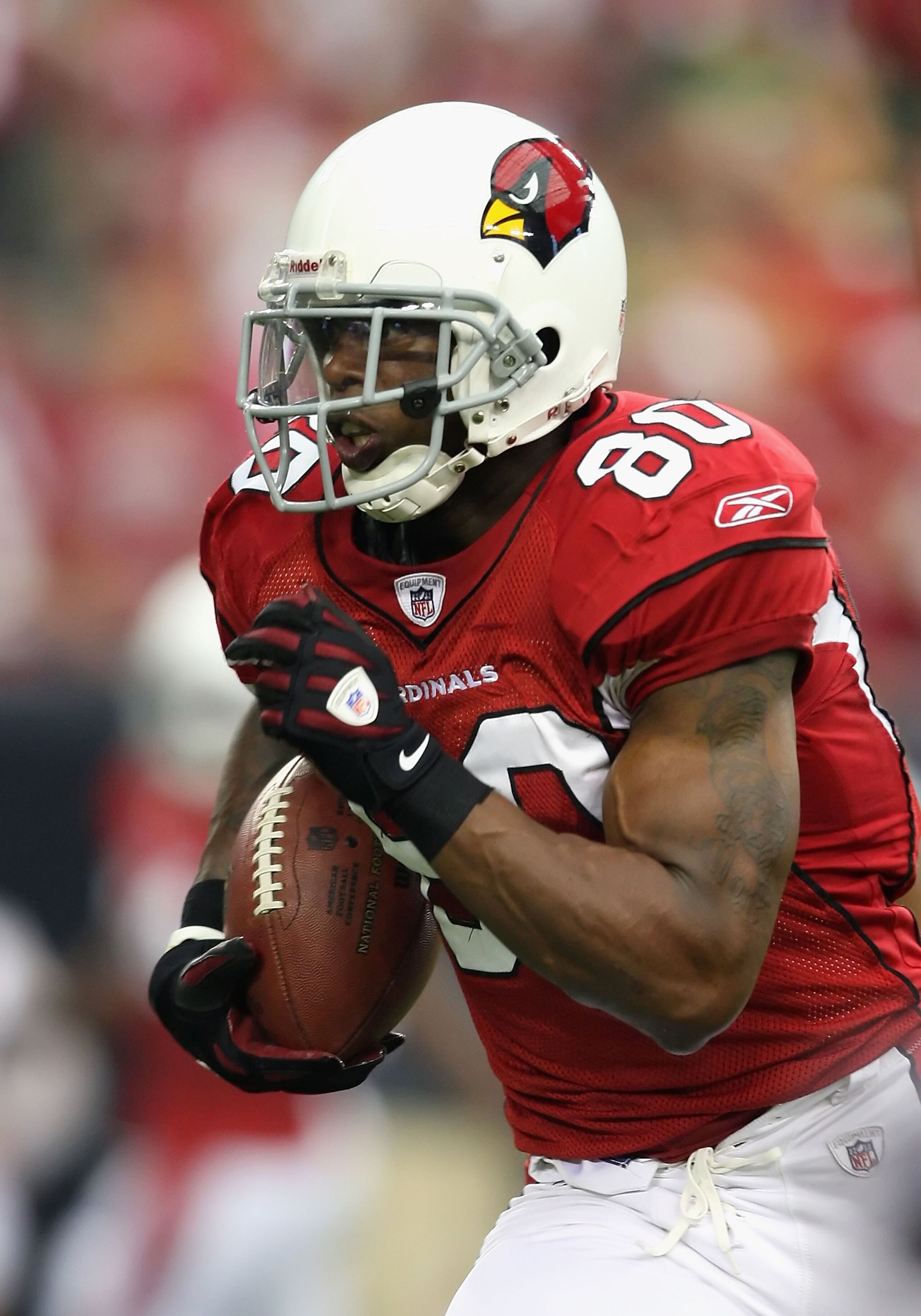 GLENDALE, AZ - JANUARY 10:  Wide receiver Early Doucet #80 of the Arizona Cardinals runs with the football during the 2010 NFC wild-card playoff game against  the Green Bay Packers at the Universtity of Phoenix Stadium on January 10, 2010 in Glendale, Ari