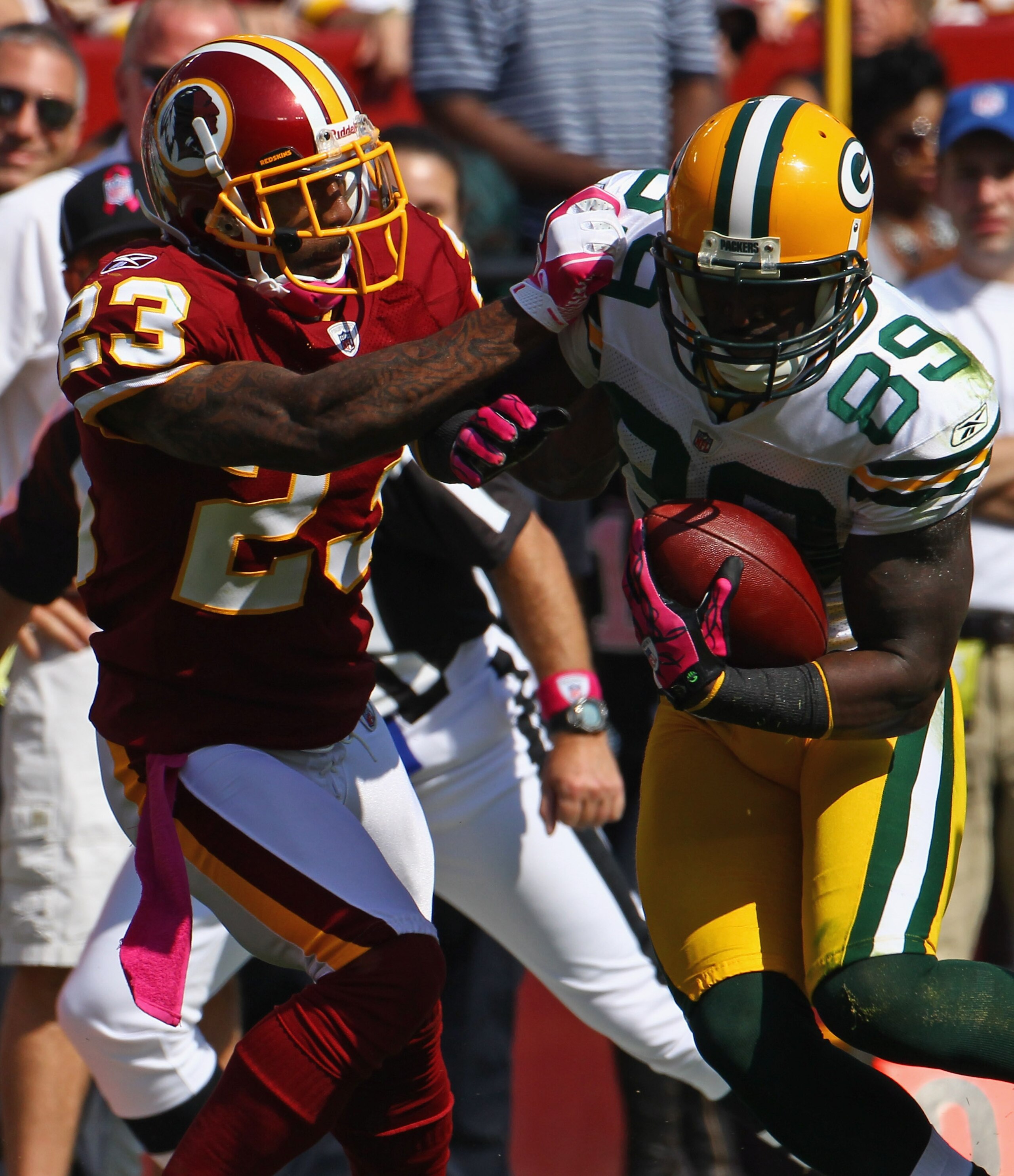 LANDOVER, MD - OCTOBER 10: Wide receiver James Jones #89 of the Green Bay Packers is tackled by cornerback DeAngelo Hall #23 the Washington Redskins at FedExField on October 10, 2010 in Landover, Maryland.  (Photo by Win McNamee/Getty Images)