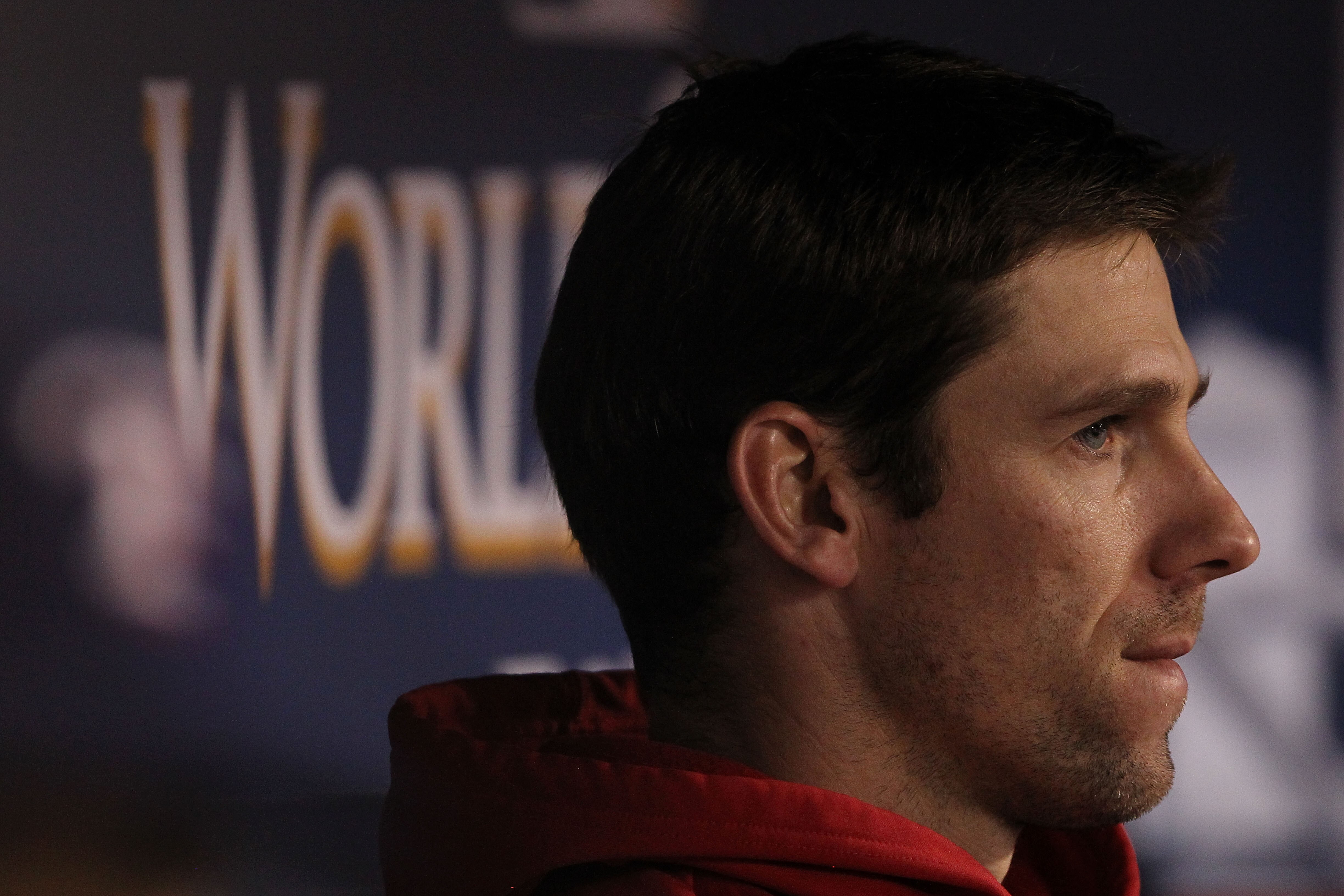 ARLINGTON, TX - NOVEMBER 01:  Losing pitcher Cliff Lee #33 of the Texas Rangers looks on from the dugout against the San Francisco Giants in Game Five of the 2010 MLB World Series at Rangers Ballpark in Arlington on November 1, 2010 in Arlington, Texas.