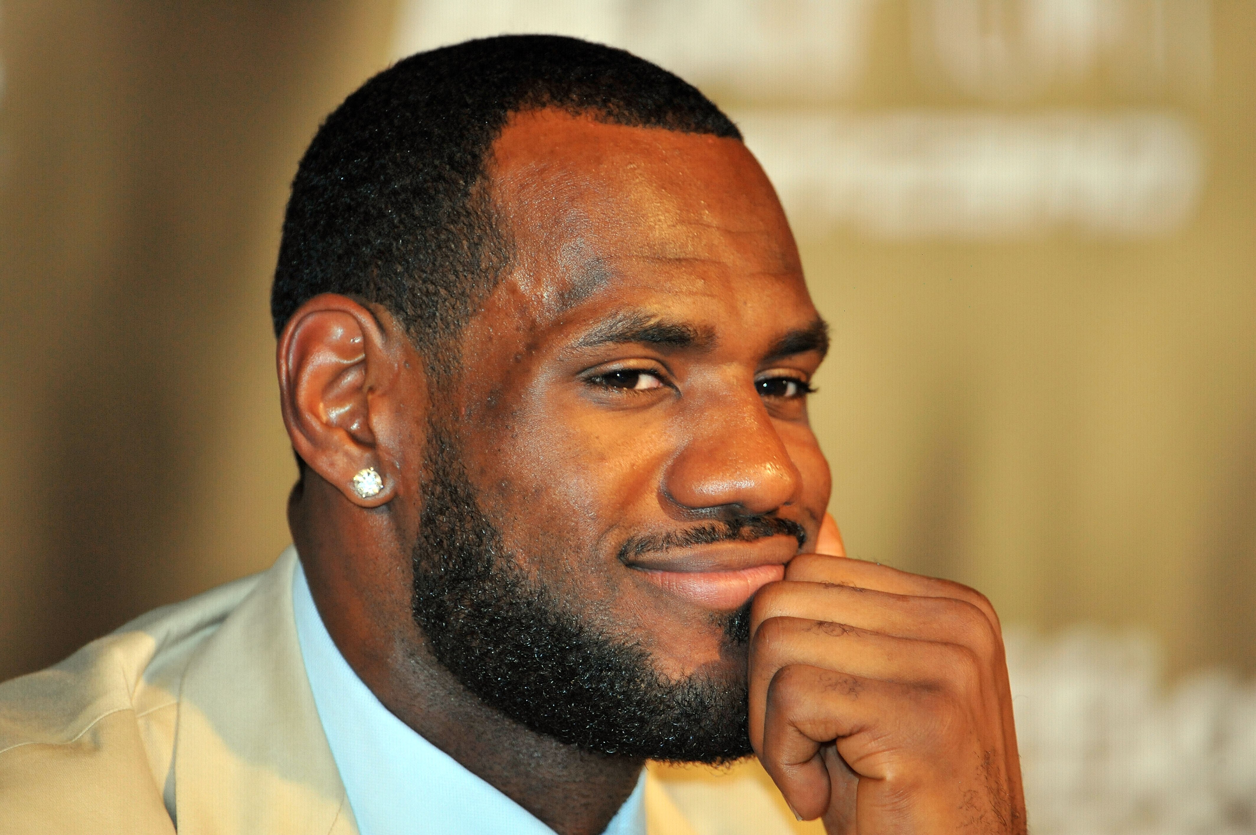 MIAMI - JULY 09:  LeBron James #6, of the Miami Heat smiles during a press conference after a welcome party at American Airlines Arena on July 9, 2010 in Miami, Florida.  (Photo by Doug Benc/Getty Images)